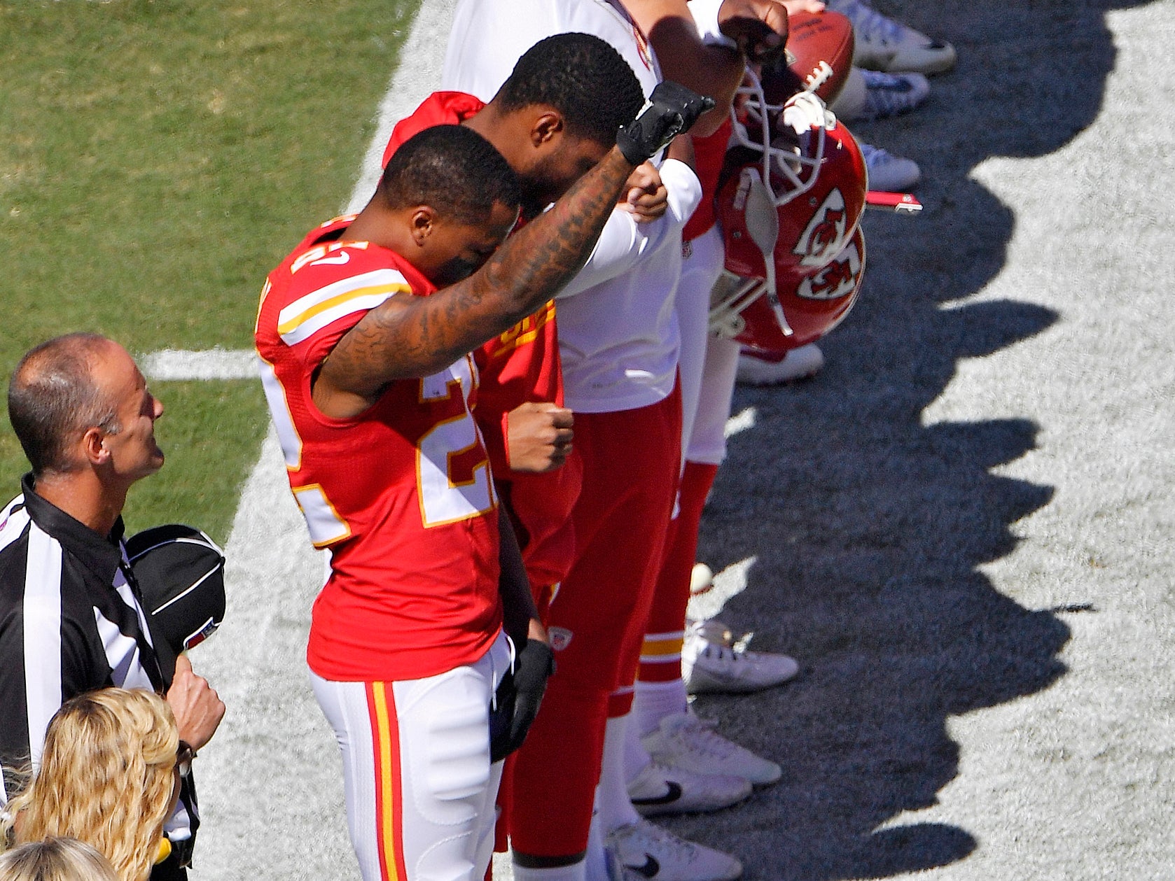 Kansas City Chiefs cornerback Marcus Peters raises his fist in the air during the national anthem before an NFL football game against the San Diego Chargers on Sunday