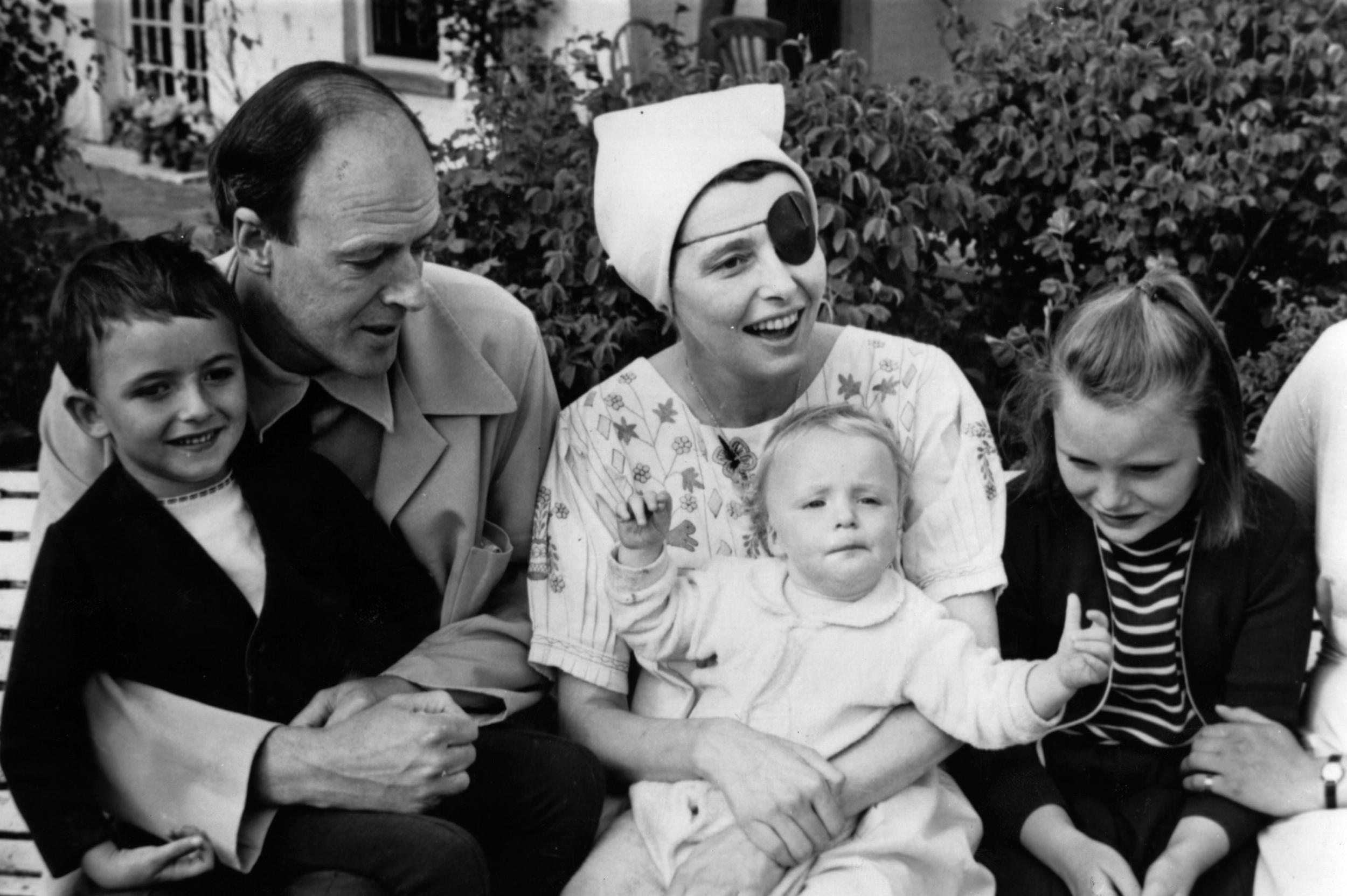 Patricia Neal, seen wearing an eye patch after a series of strokes, accompanied by Dahl, and their three children