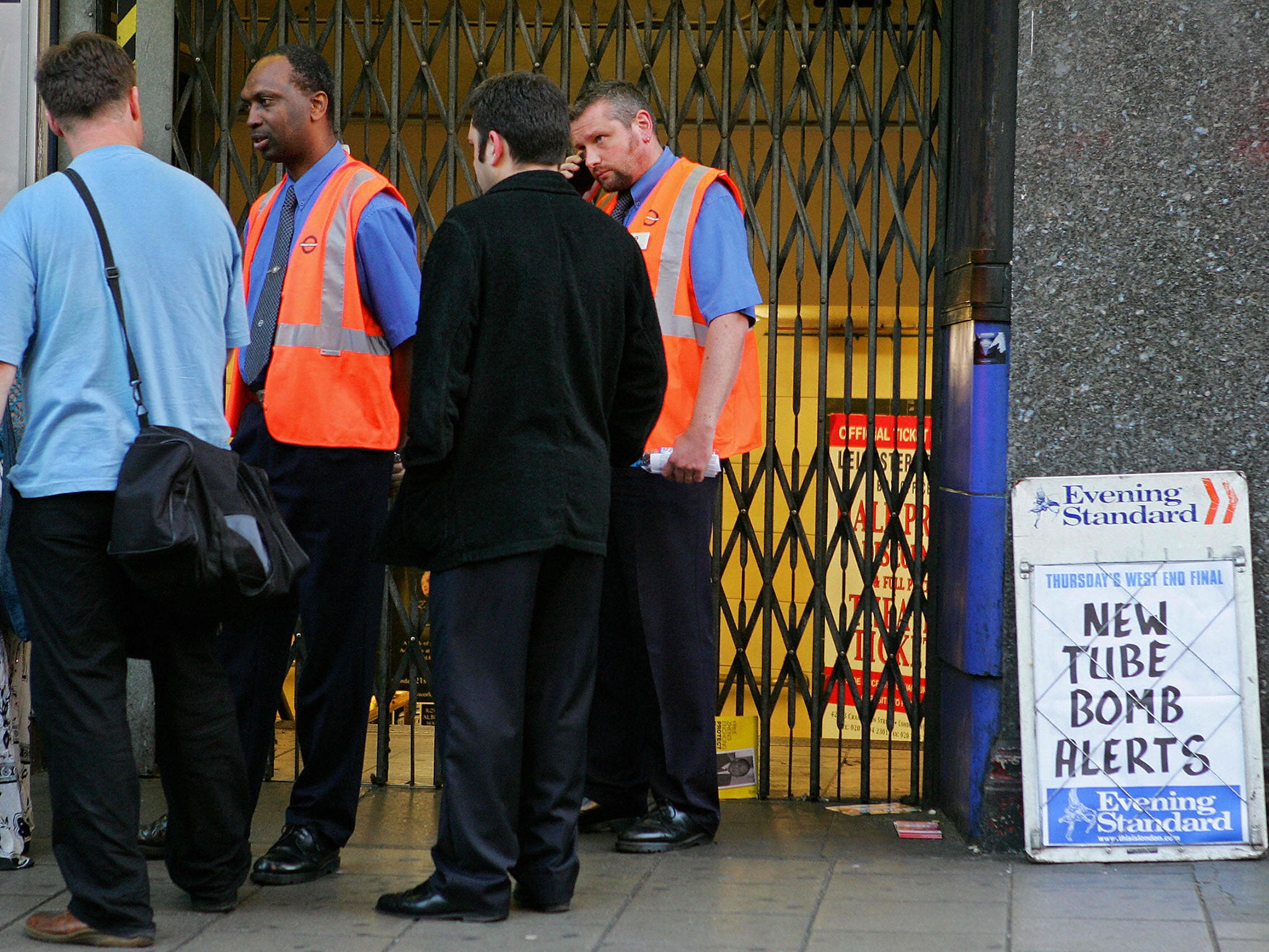 Underground staff at Leicester Square station direct commuters after the attempted bombings of 21 July, 2005