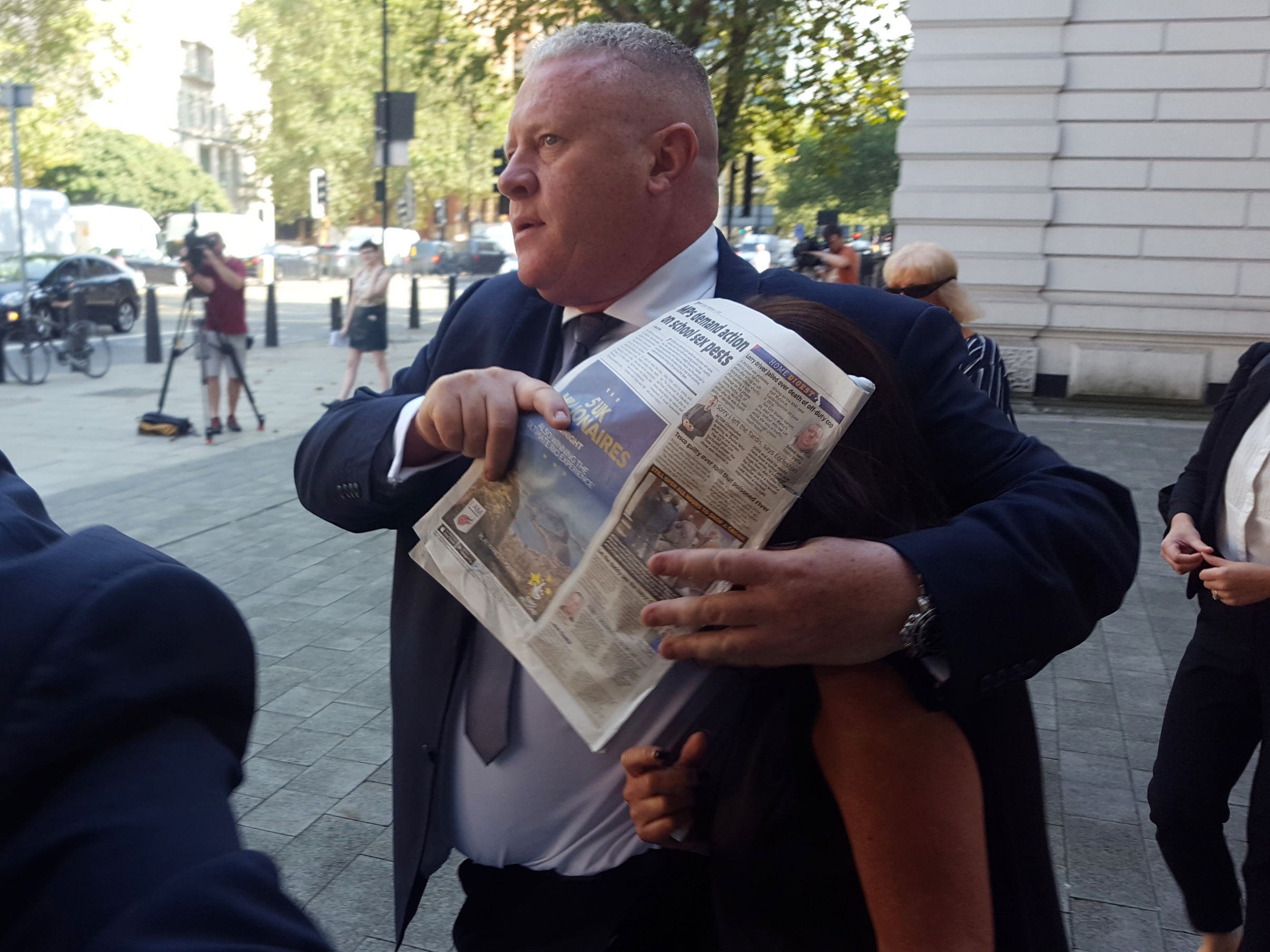 Gail Purcell, 58, leaves Westminster Magistrates' Court with her face covered