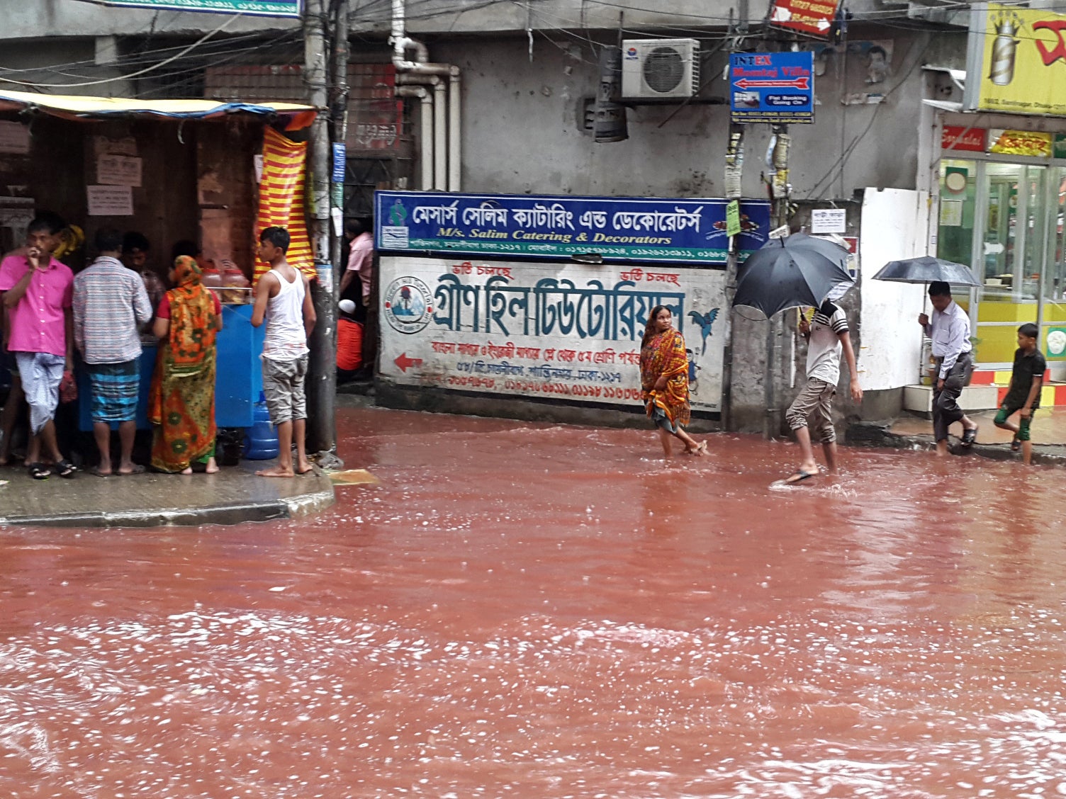 Dhaka's underdeveloped drainage system could not cope with heavy rains that mixed with the blood spilling from the animals