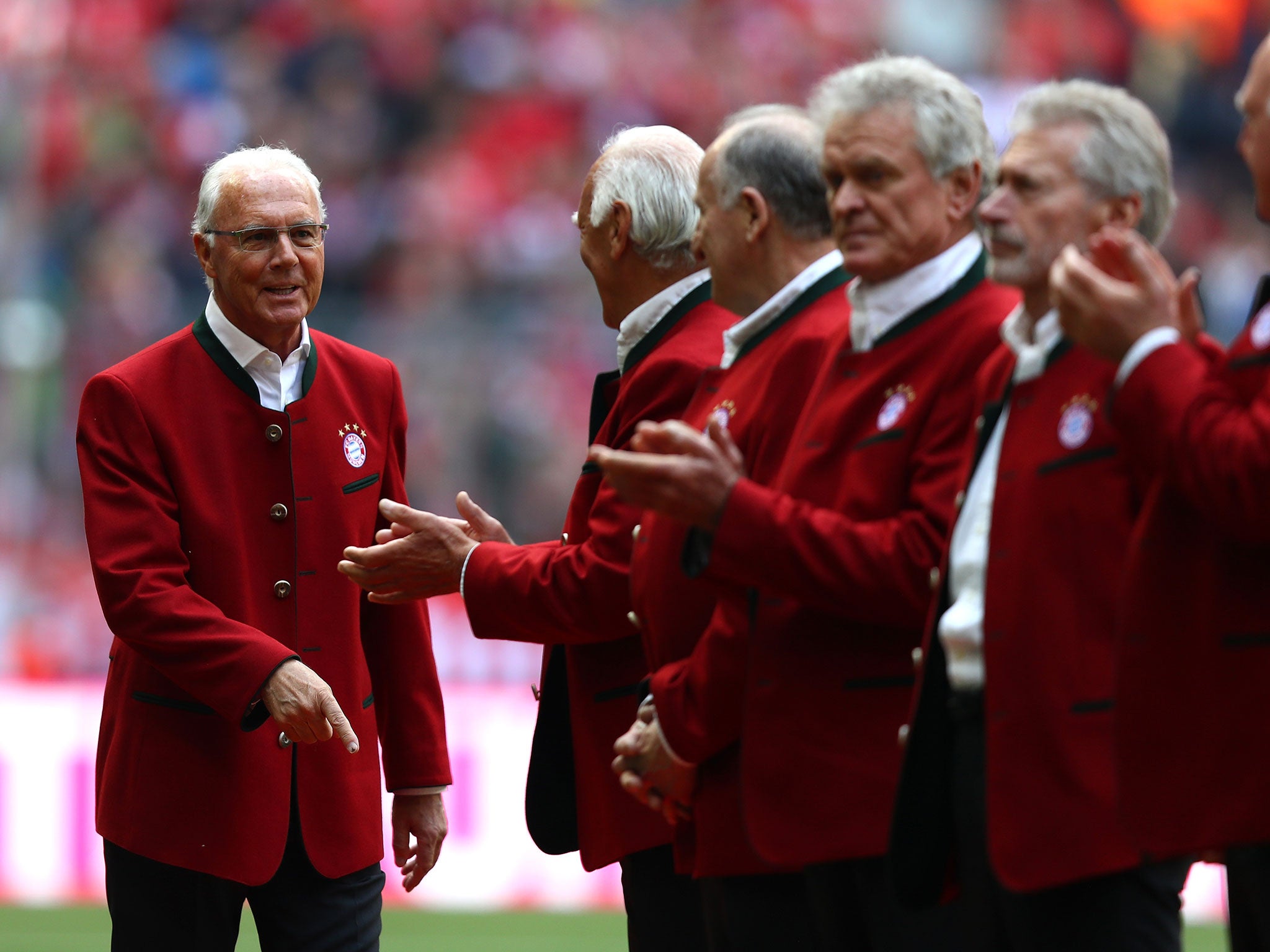 Franz Beckenbauer (L), FC Bayern president of honour is introduced prior to the Bundesliga match between FC Bayern Muenchen and Hannover 96 at Allianz Arena on May 14, 2016 in Munich