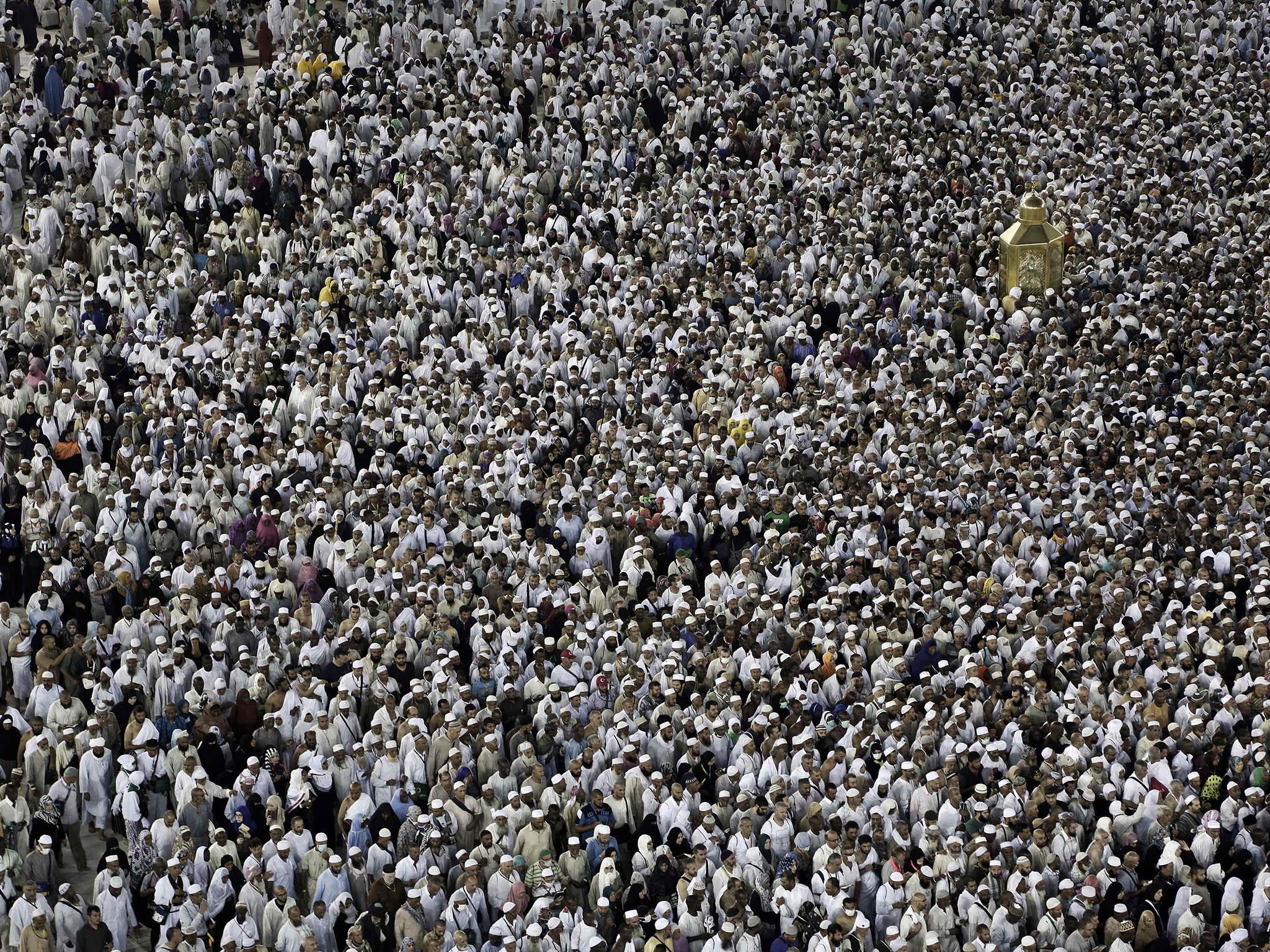 While circling the Kaaba, Muslims try to touch Maqam Ibrahim or The Station of Abraham, the golden glass structure top right, at the Grand Mosque