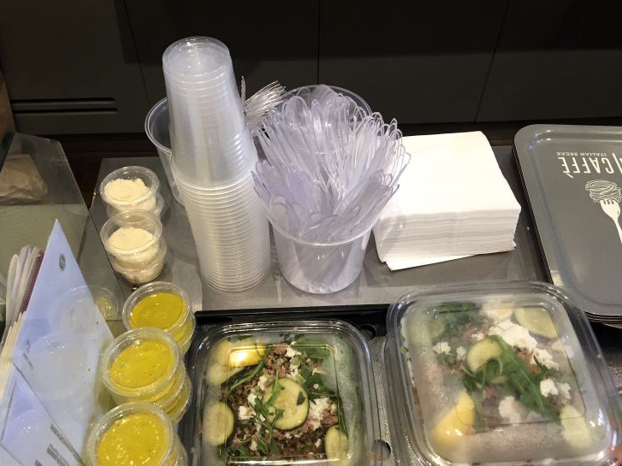 Plastic glasses, knives, forks and food boxes are pictured in a takeaway restaurant in Paris