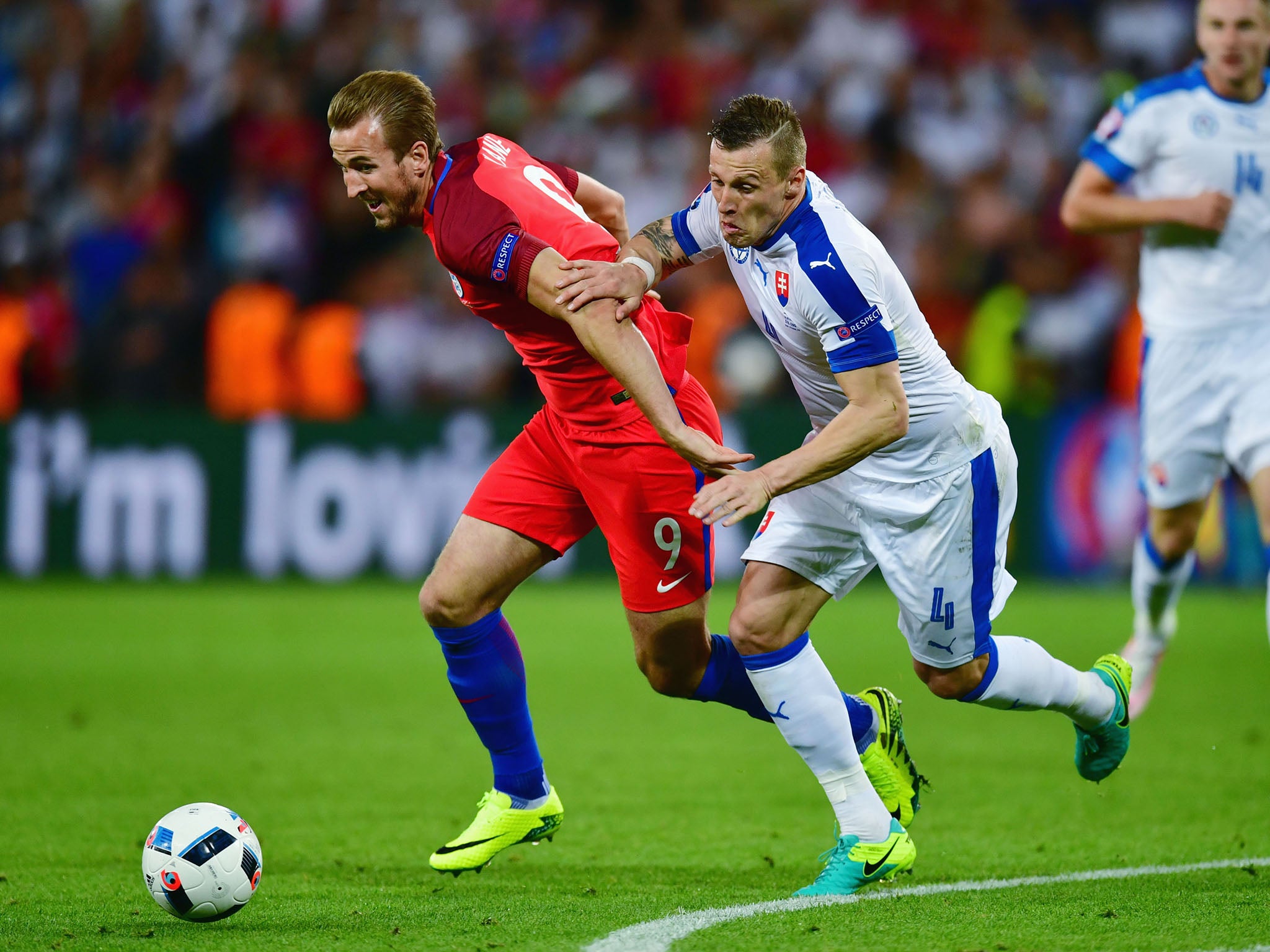 Jan Durica battle Harry Kane for the ball