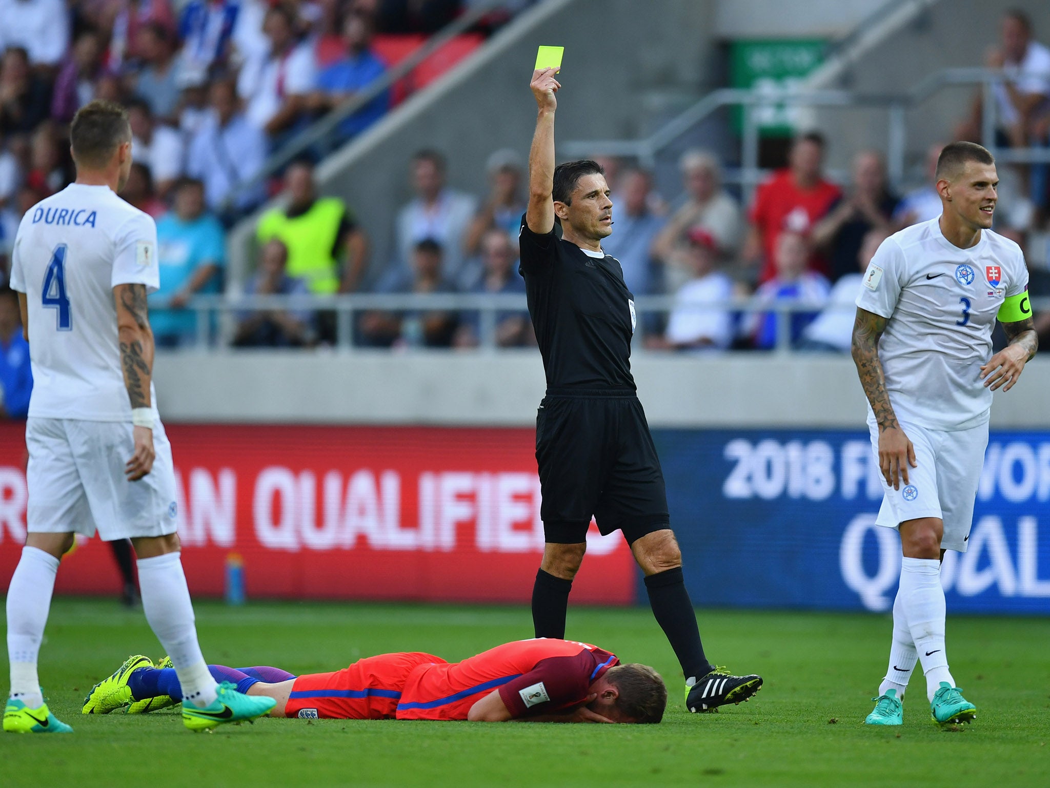 Martin Skrtel picks up the first of his two yellow cards