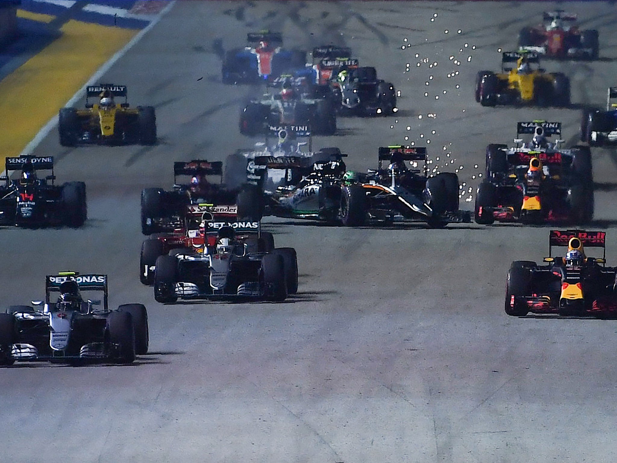 Nico Hulkenberg is spun into the pit wall after colliding with Carlos Sainz