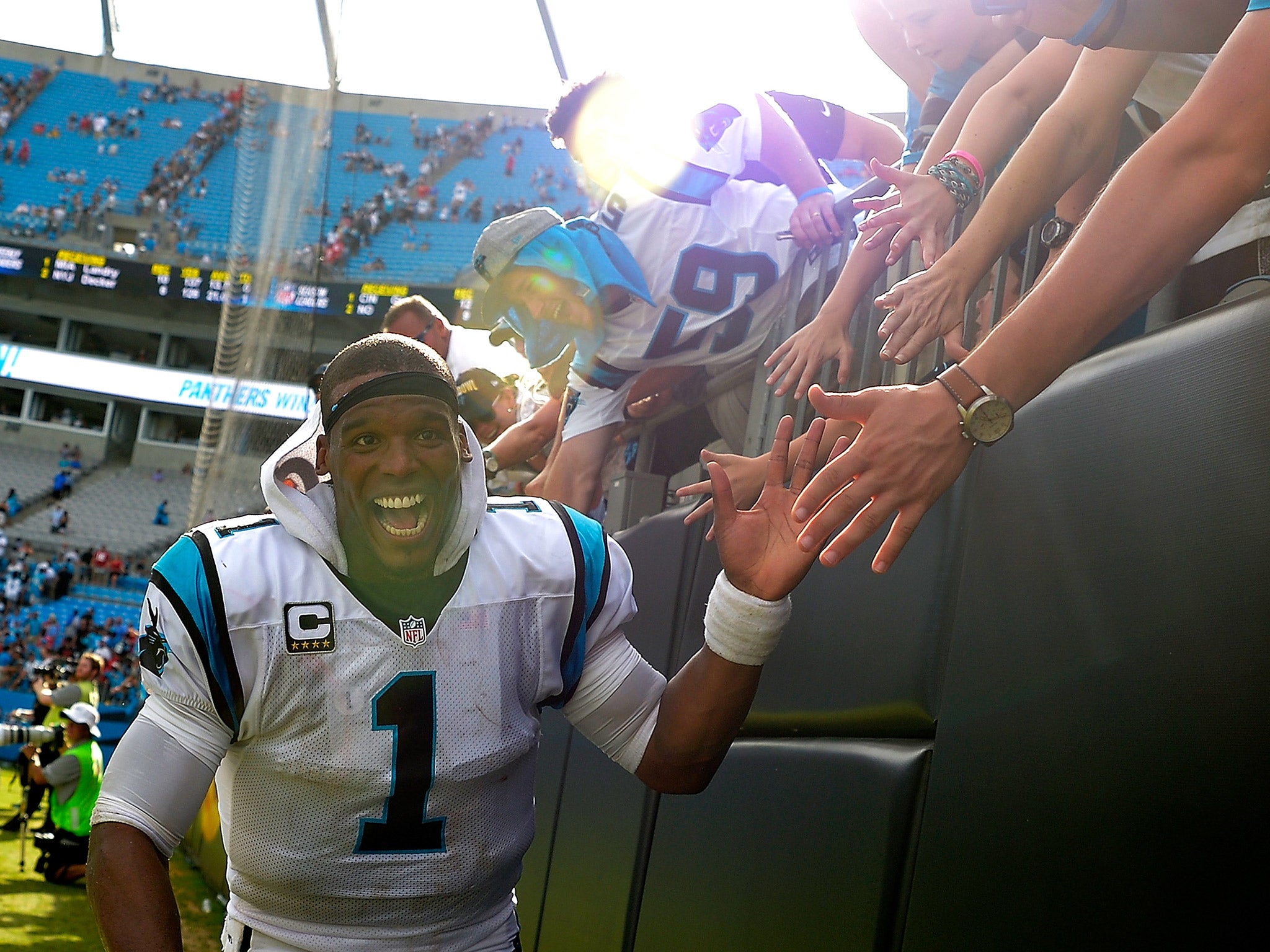 Cam Newton celebrates with fans after the Carolina Panthers beat the San Francisco 49ers