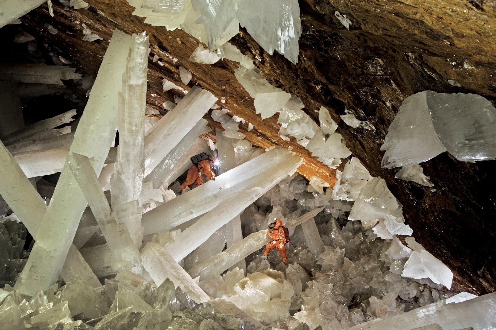 Cavers climbing a web of enormous gypsum crystals in the Mexican state of Chihuahua (Carsten Peter/Speleoresearch &amp;amp; Films/National Geographic)