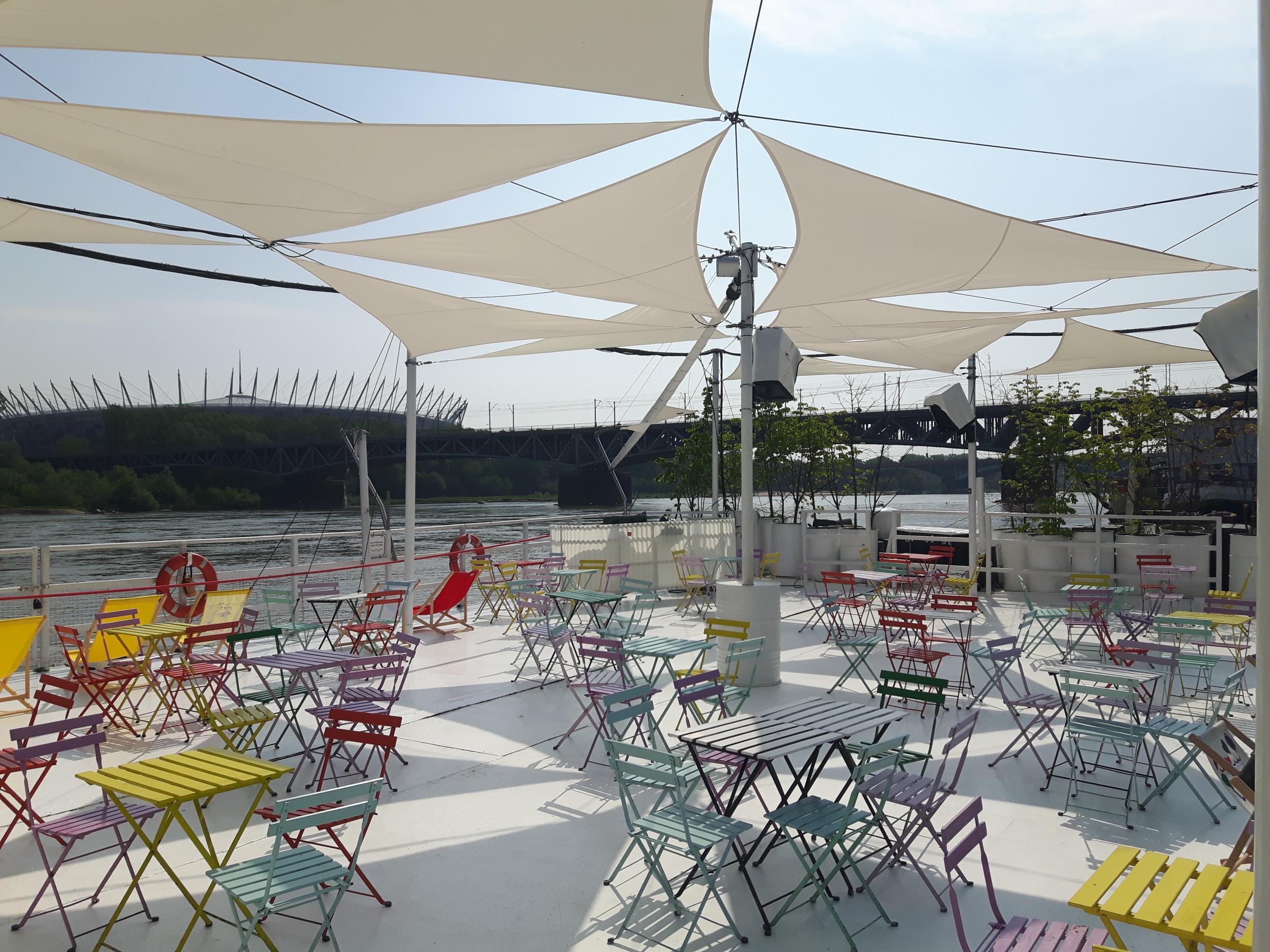 BarKa is a sunny spot on the deck of a converted barge