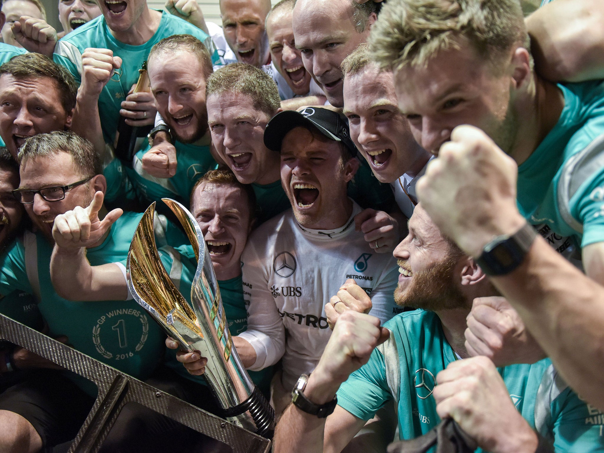 Nico Rosberg celebrates his Singapore Grand Prix victory with his Mercedes mechanics