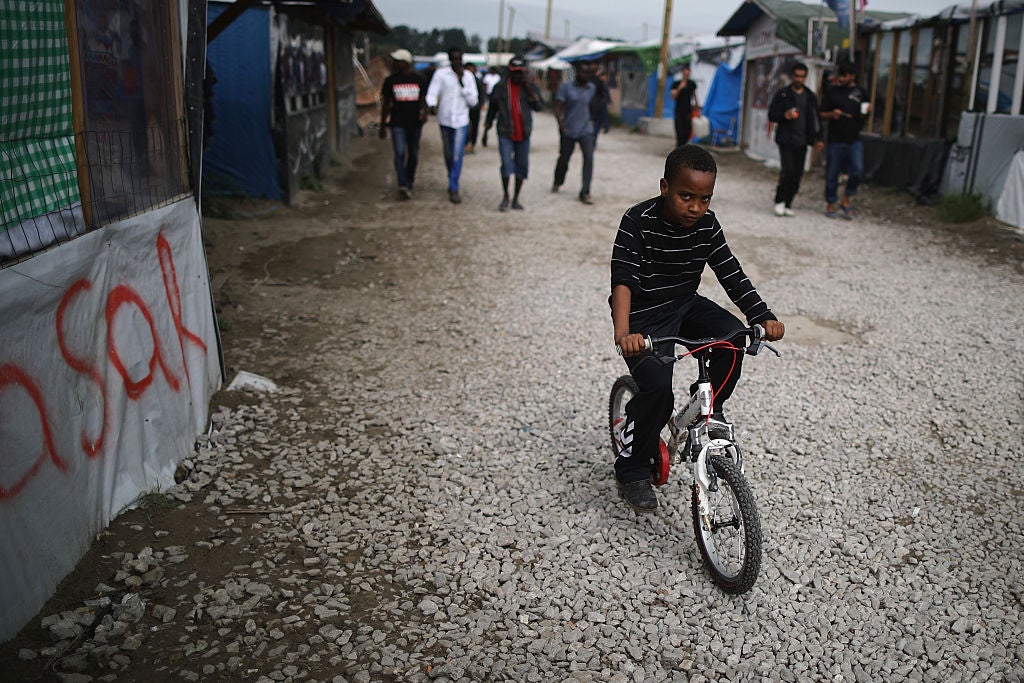 Children and young people inside the Calais makeshift refugee camp known as the Jungle