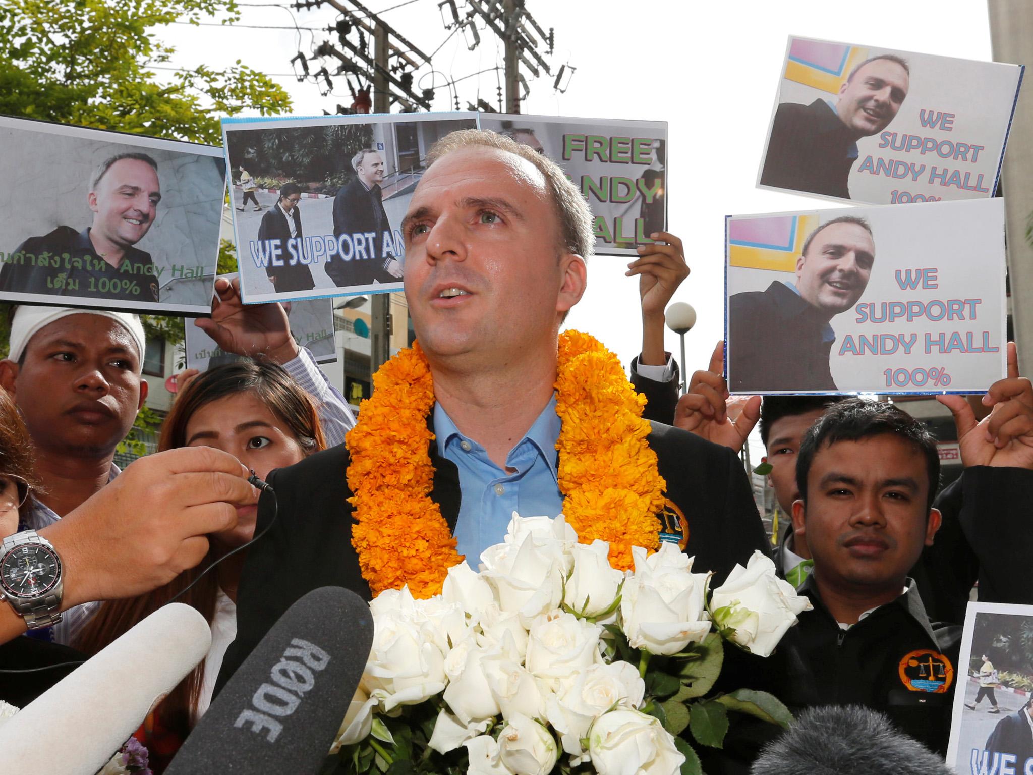 British rights activist Andy Hall left court in Bangkok after receiving a three-year suspended sentence