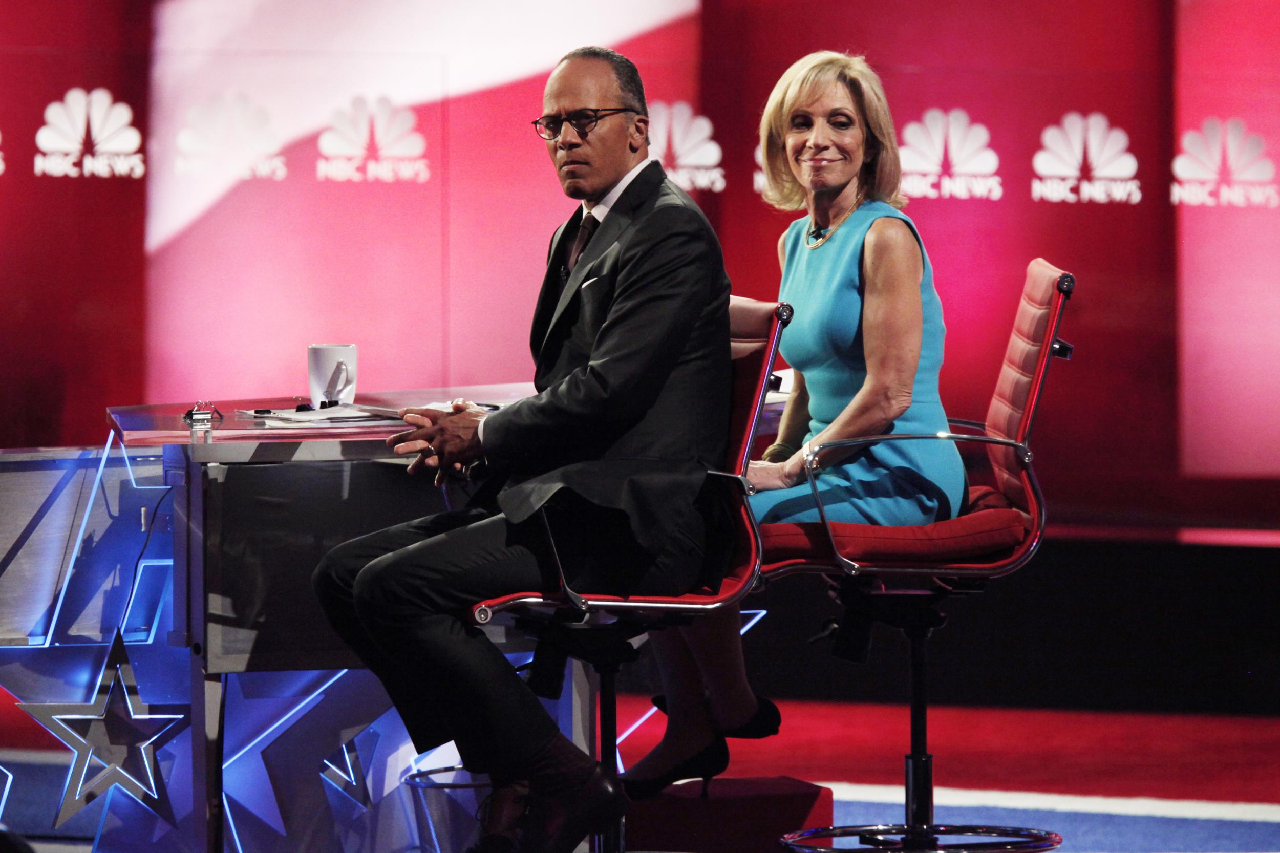 Lester Holt with his colleague Andrea Mitchell during a Democratic presidential debate in January