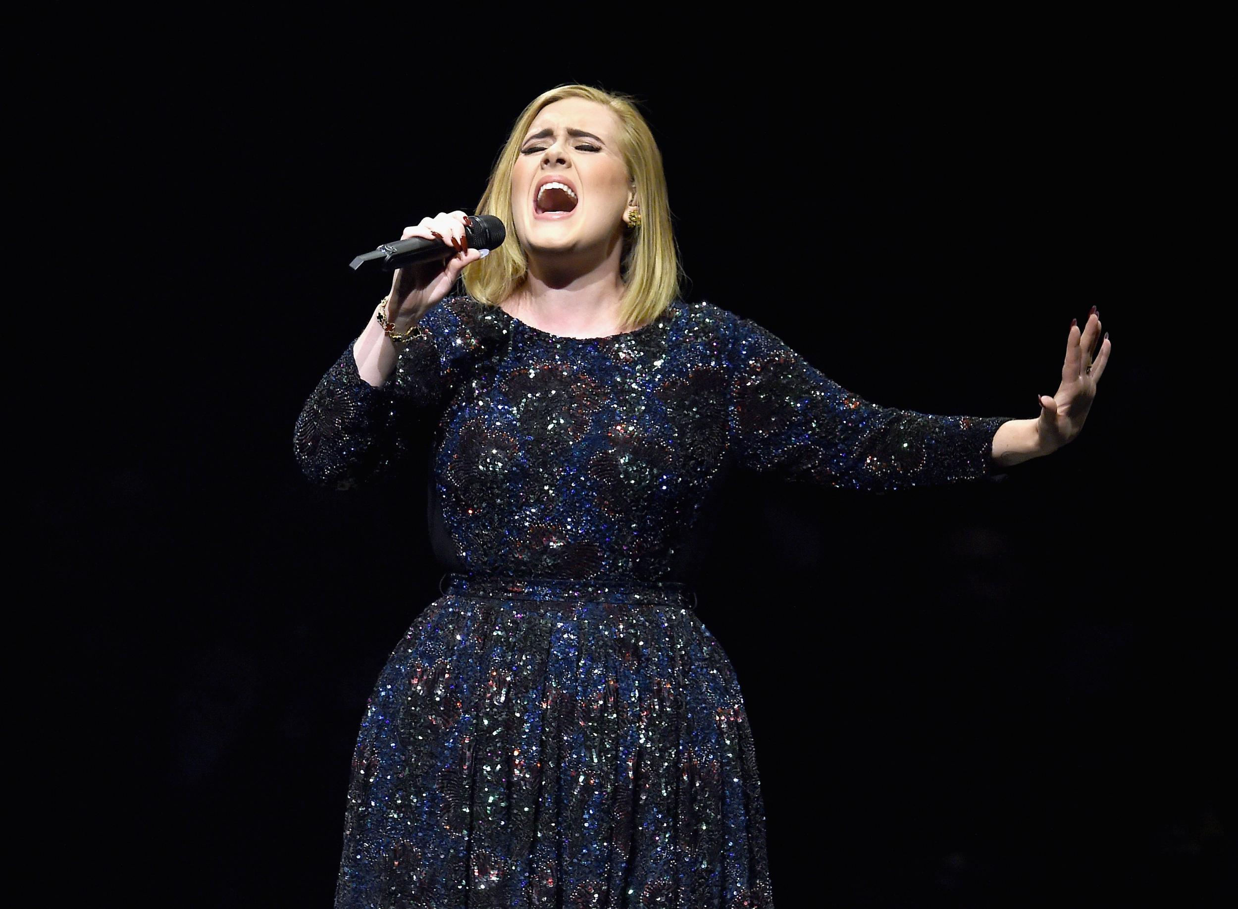 Adele performs on stage