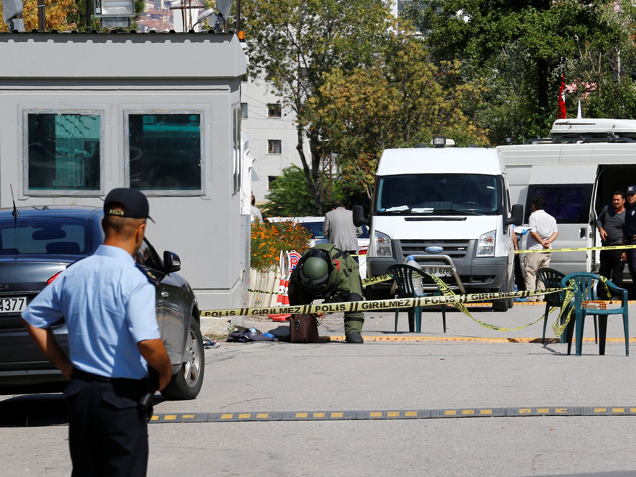 A bomb disposal expert examines a bag in front of the Israeli Embassy in Ankara, Turkey, September 21, 2016.