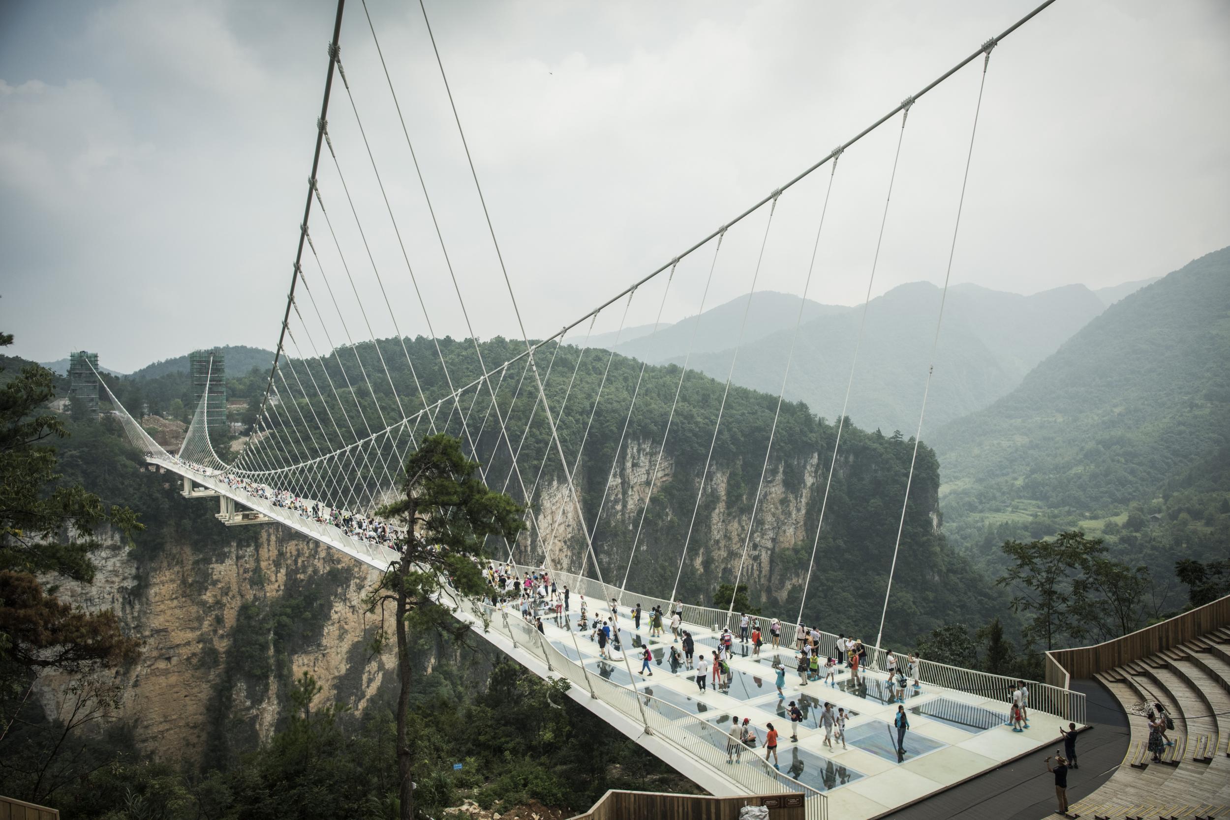 The world's longest and highest glass bridge opened in Hunan in August