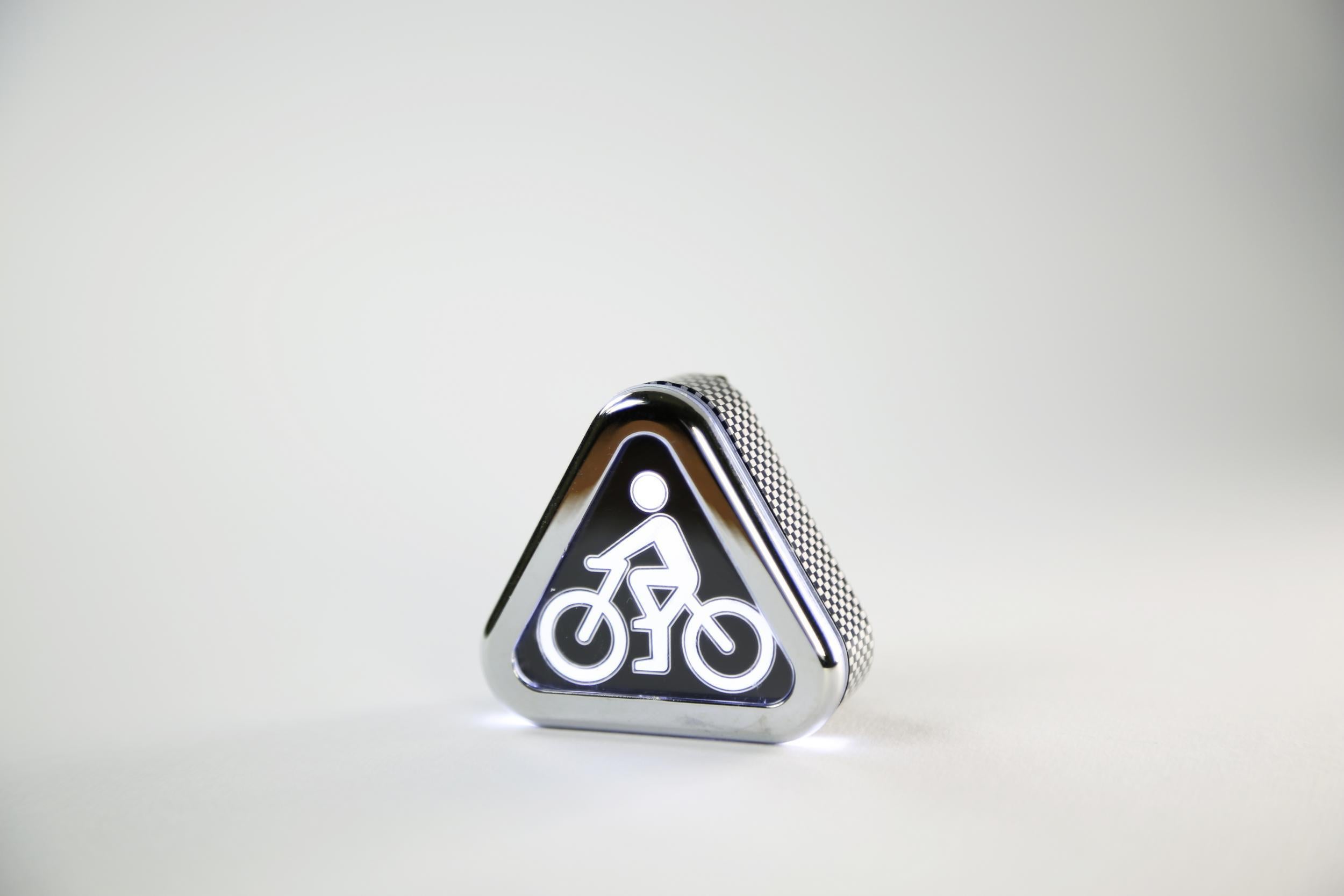 Brainy Bike Light's triangular design efficiently communicates the need for drivers to exercise caution