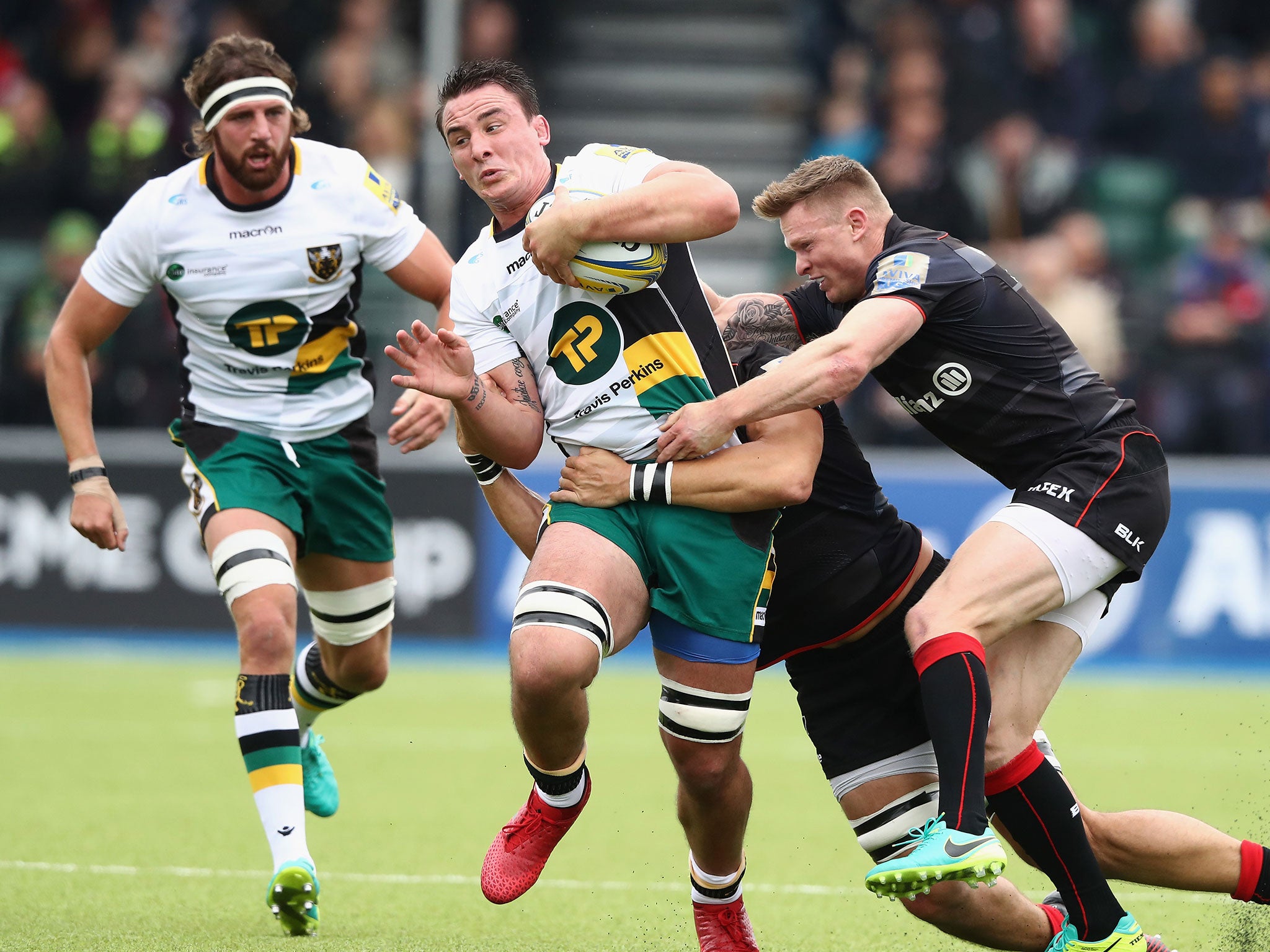 &#13;
Chris Ashton tackles Louis Picamoles during Saracen's league match against Northampton &#13;