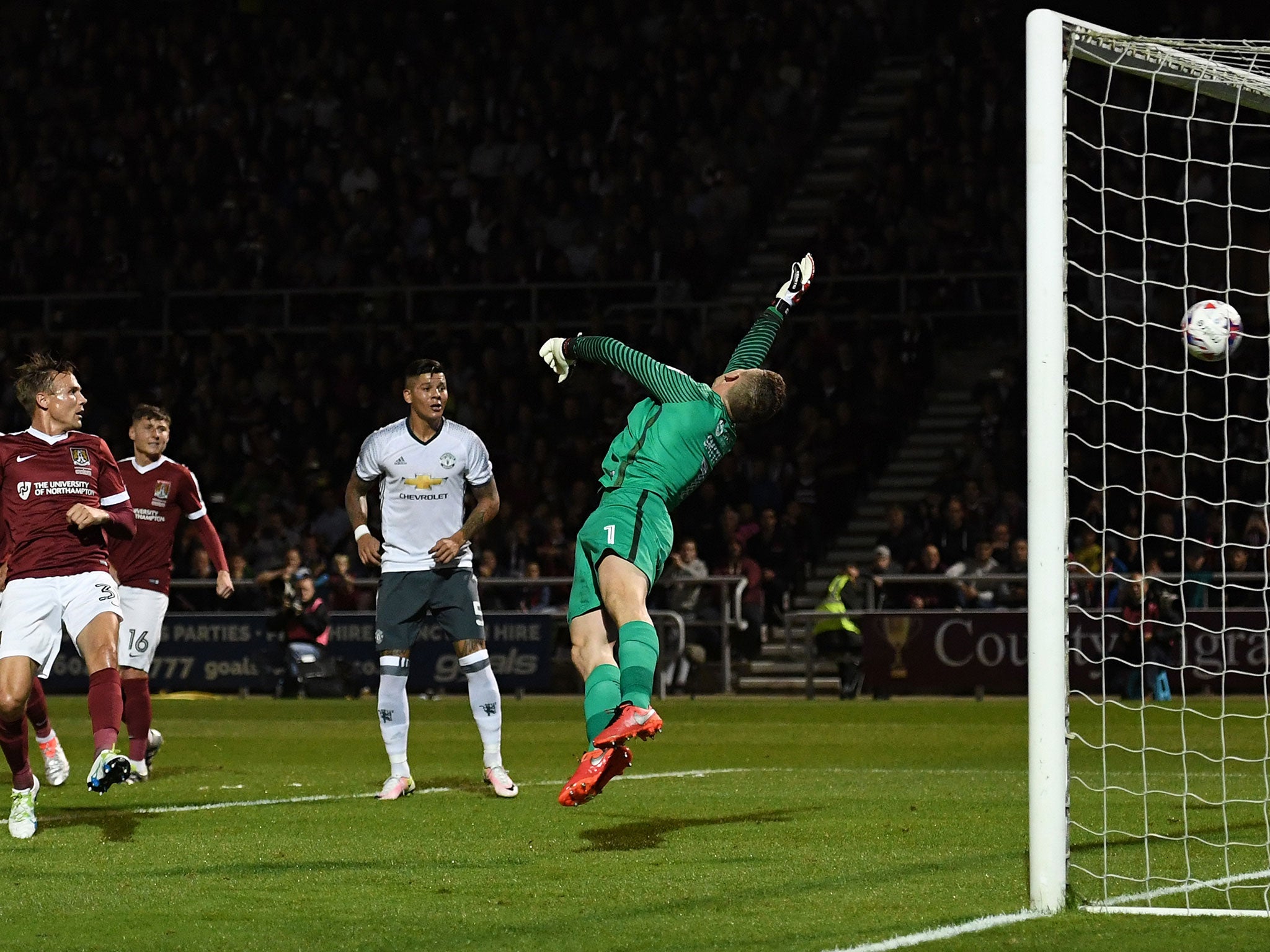 Carrick's goal flies past Northampton's Smith