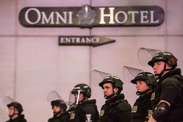 Armed police in riot gear face off with protesters in uptown Charlotte