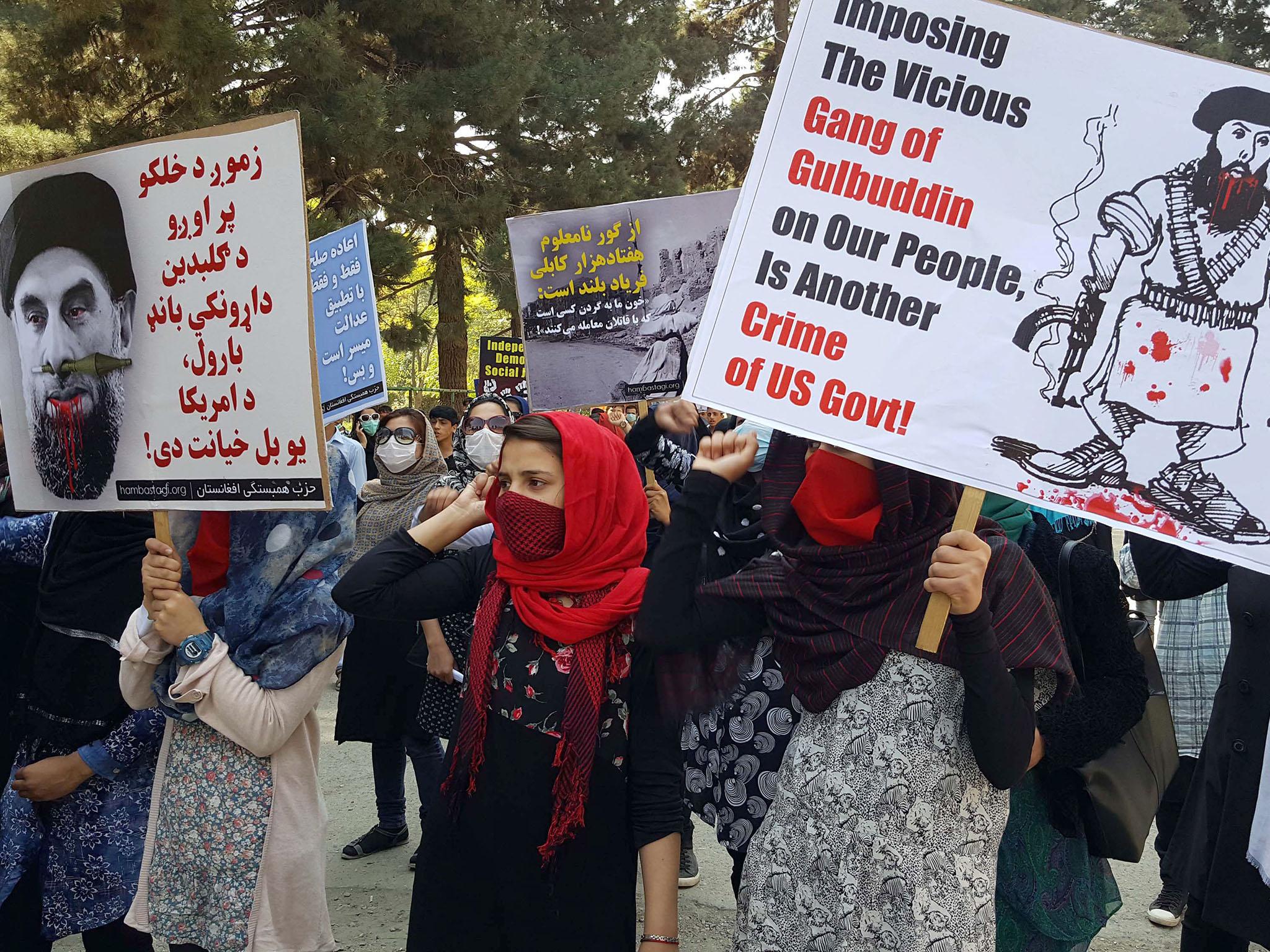 Afghans chant slogans against Gulbuddin Hekmatyar, the leader of Hizb-i-Islami, during a demonstration in Kabul