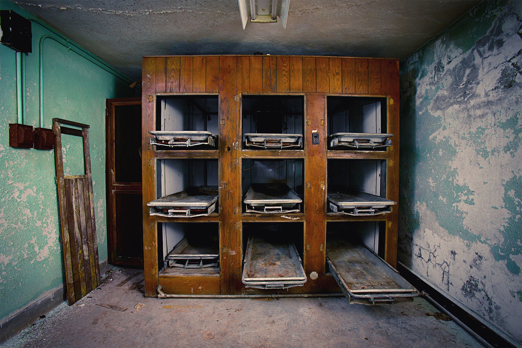 An antique wooden morgue fridge