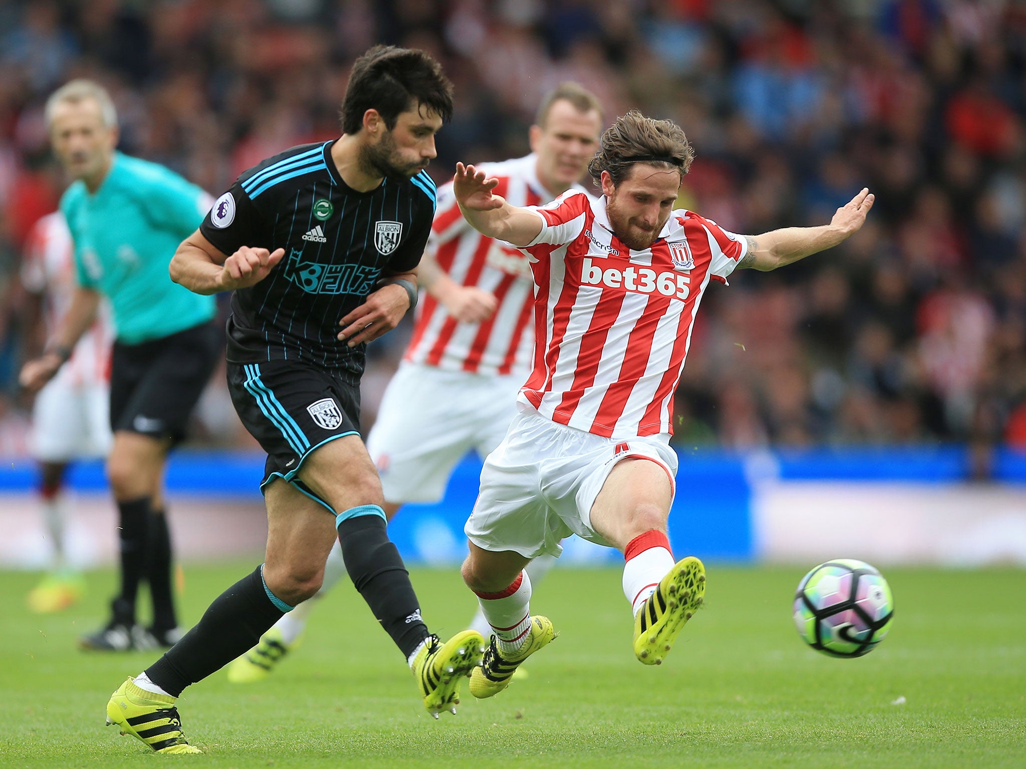 Joe Allen tries to intercept a pass from Claudio Yacob