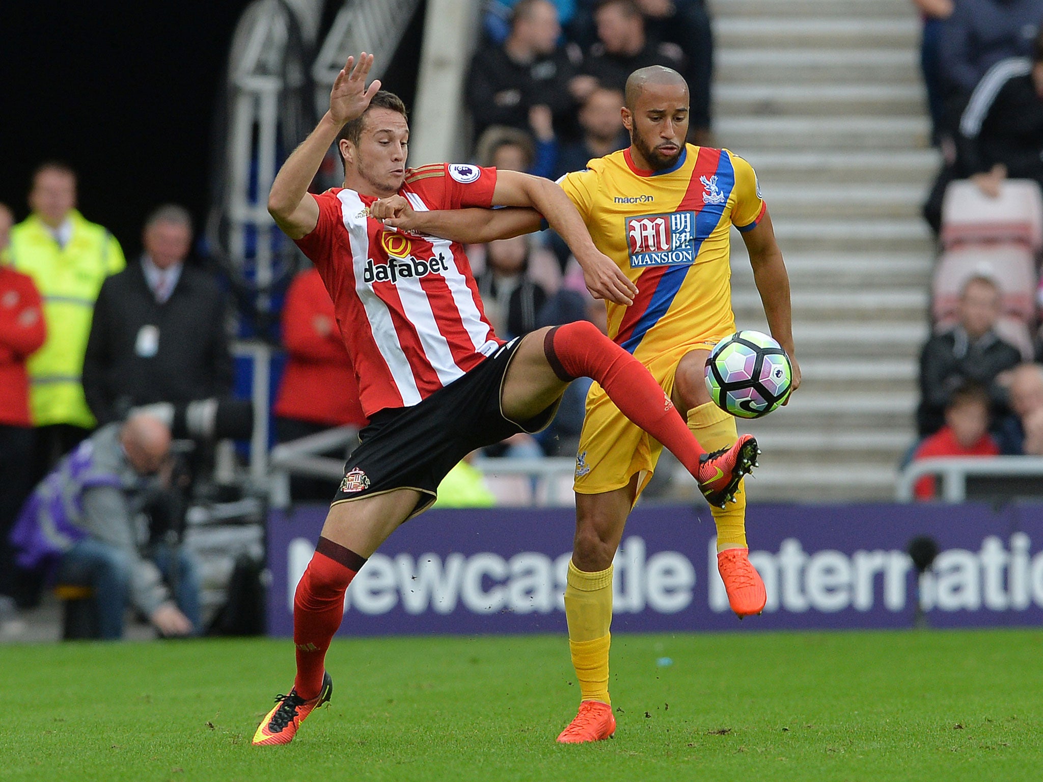 Javier Manquillo of Sunderland is tackled by Crystal Palace's Andros Townsend