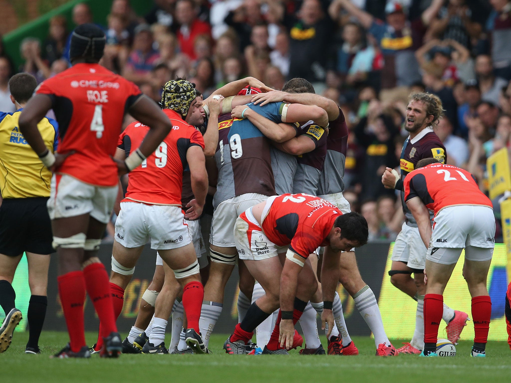 Harlequins celebrate their victory at the final whistle