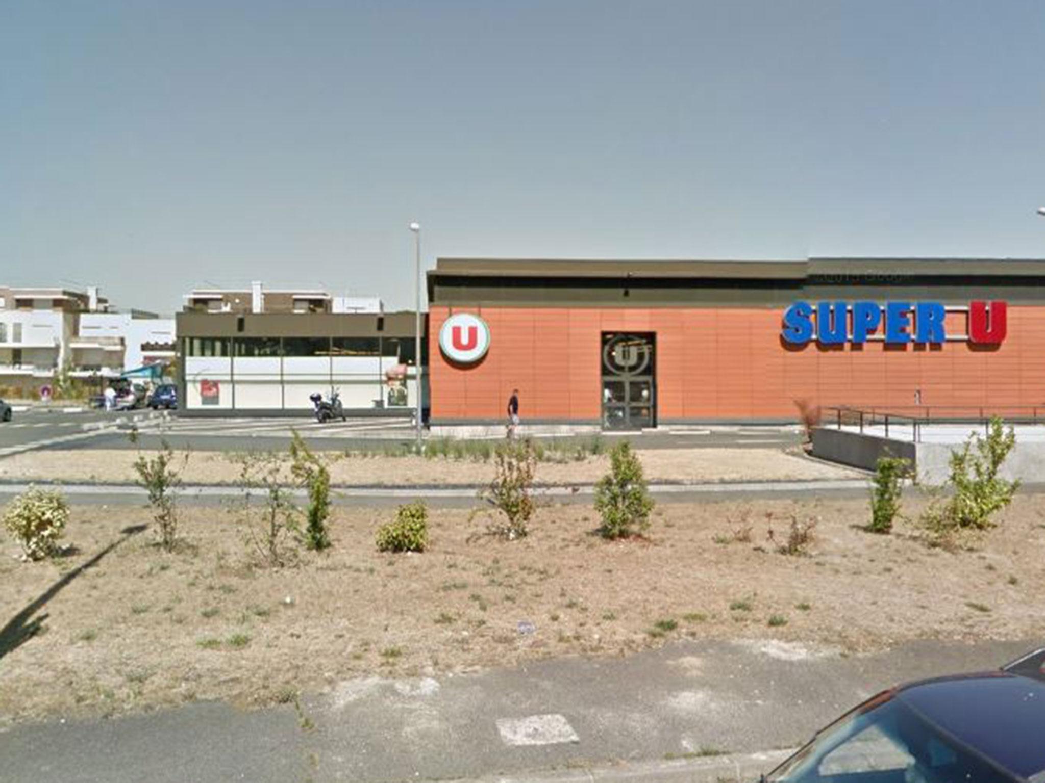 The suspect opened fire near a Super U supermarket in Port-Marly, west of Paris