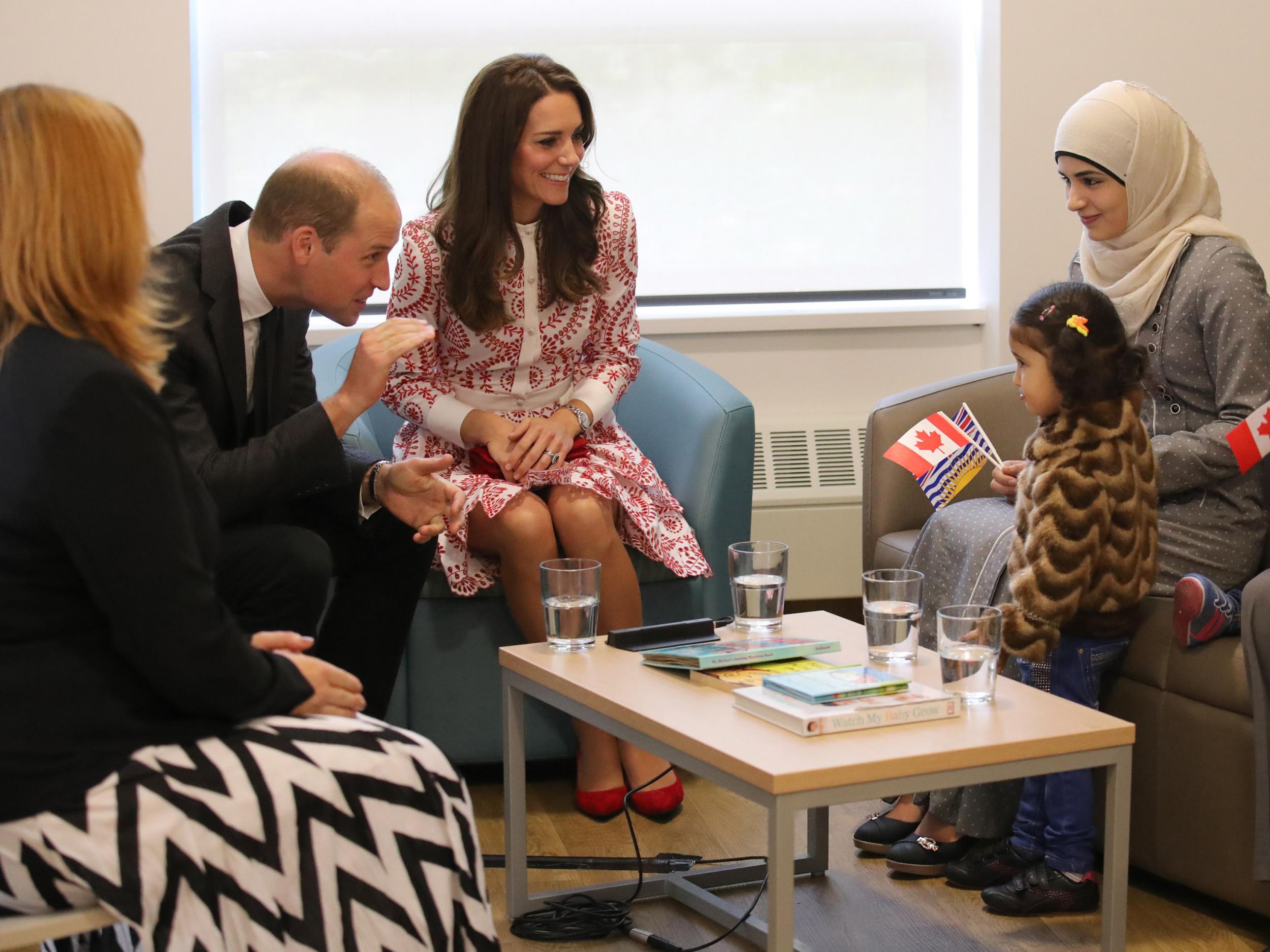 Duke and Duchess of Cambridge, with Syrian refugees Yosra Alamahameed and her daughter, Reemus, during their visit to the Immigrant Services Society of British Columbia New Welcome Centre