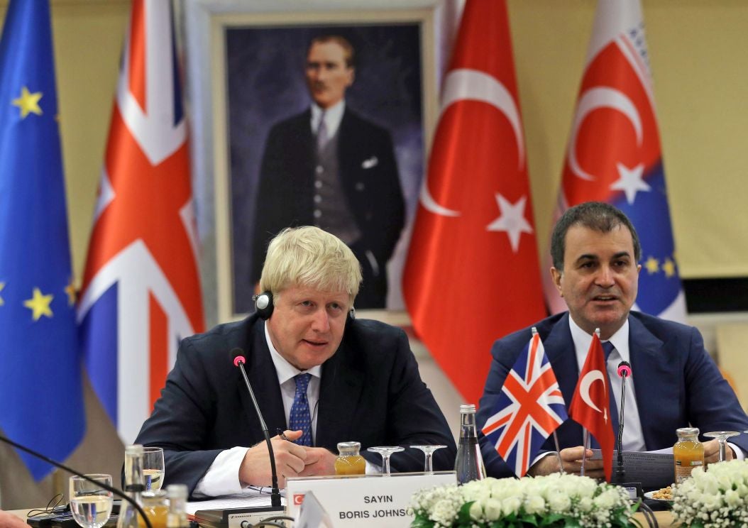 British Foreign Secretary Boris Johnson and Turkey's EU Minister Omer Celik speak to the media before a meeting in Ankara