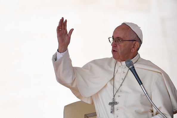 Pope Francis makes the sign of the cross at the end of his weekly general audience at St Peter's square on September 28, 2016 in Vatican. (GABRIEL BOUYS/AFP/Getty Images)