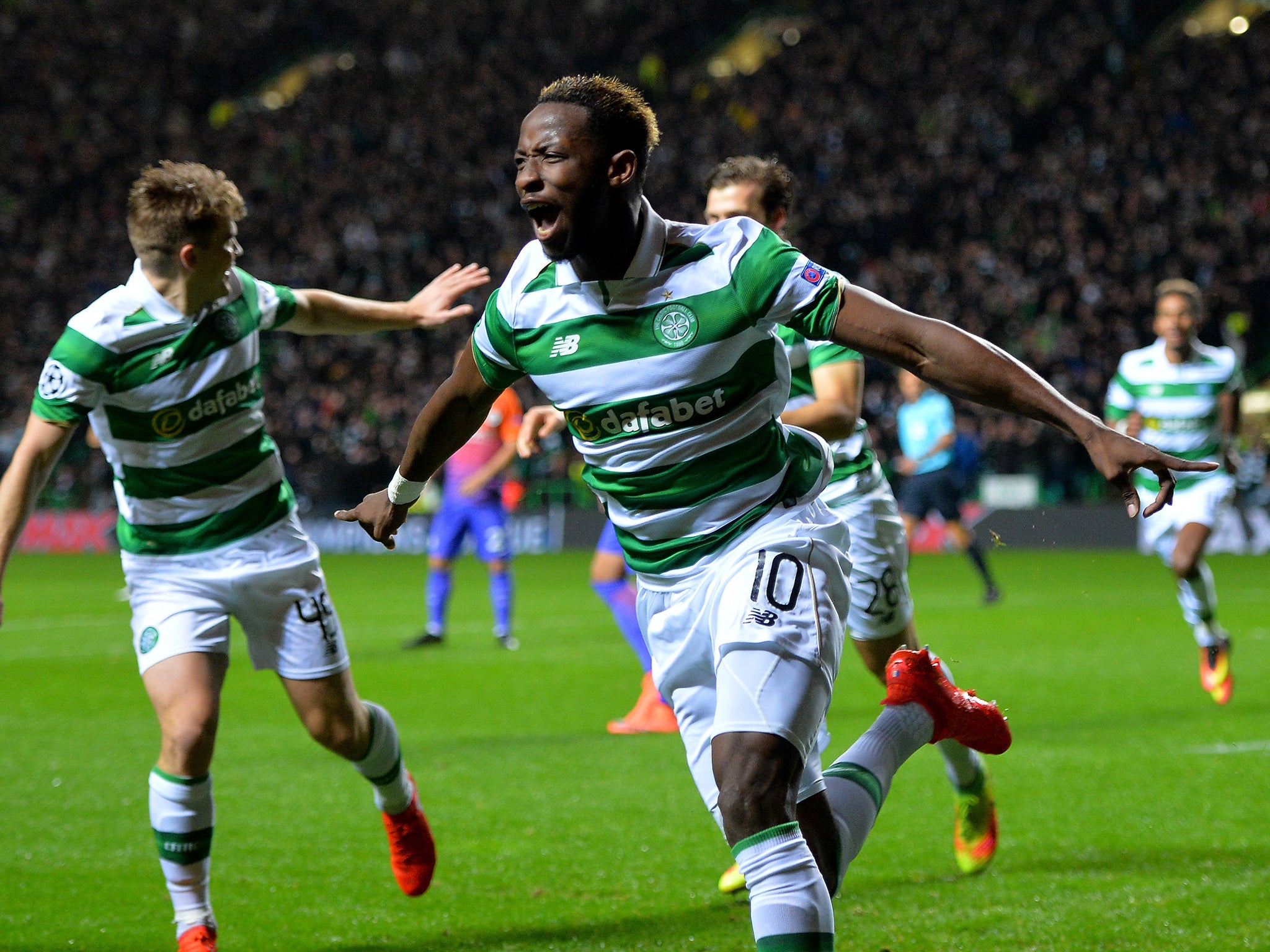 Dembele celebrates opening the scoring at Celtic Park