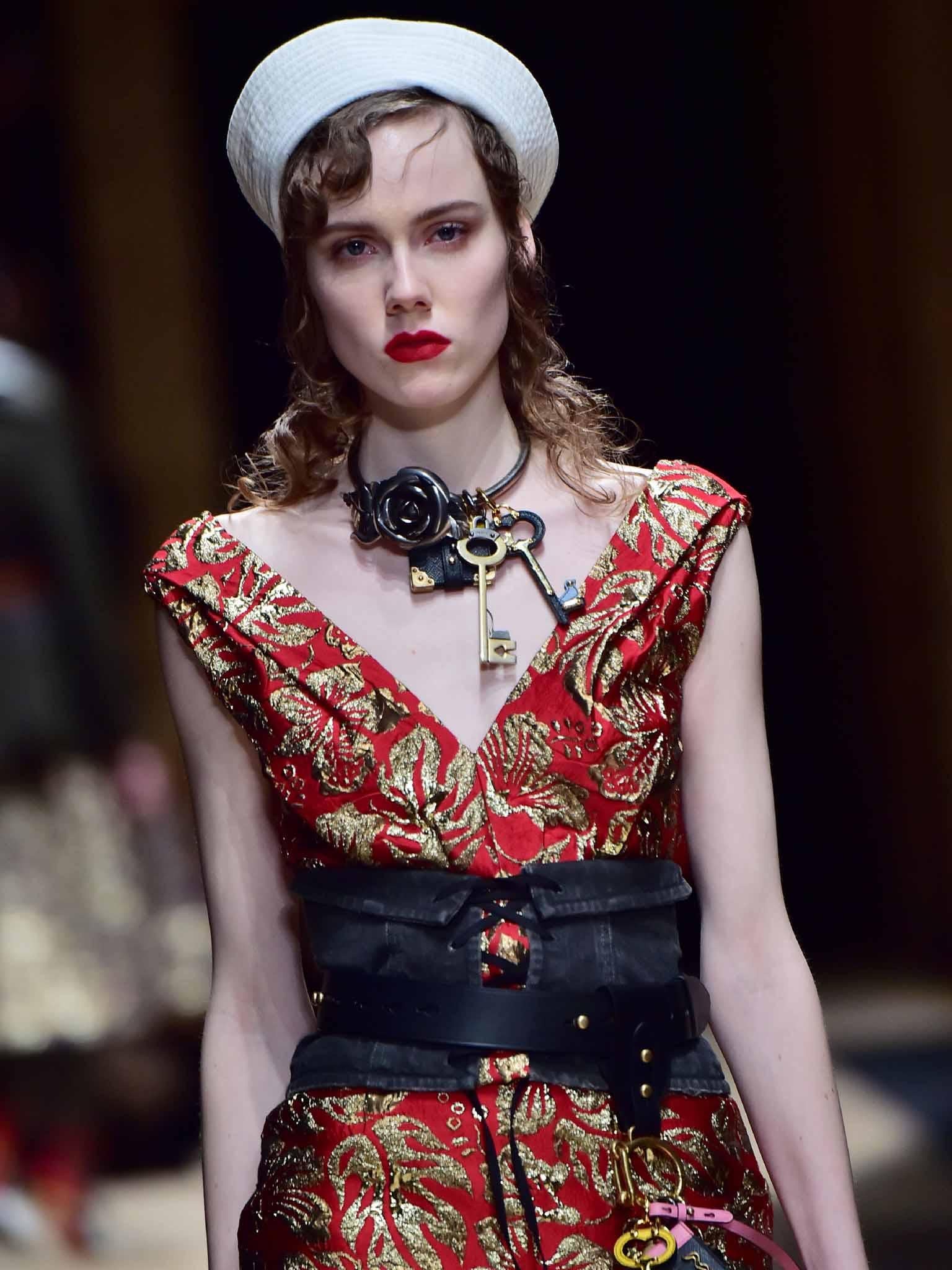 Prada teamed stark white Popeye hats with cotton corset belts