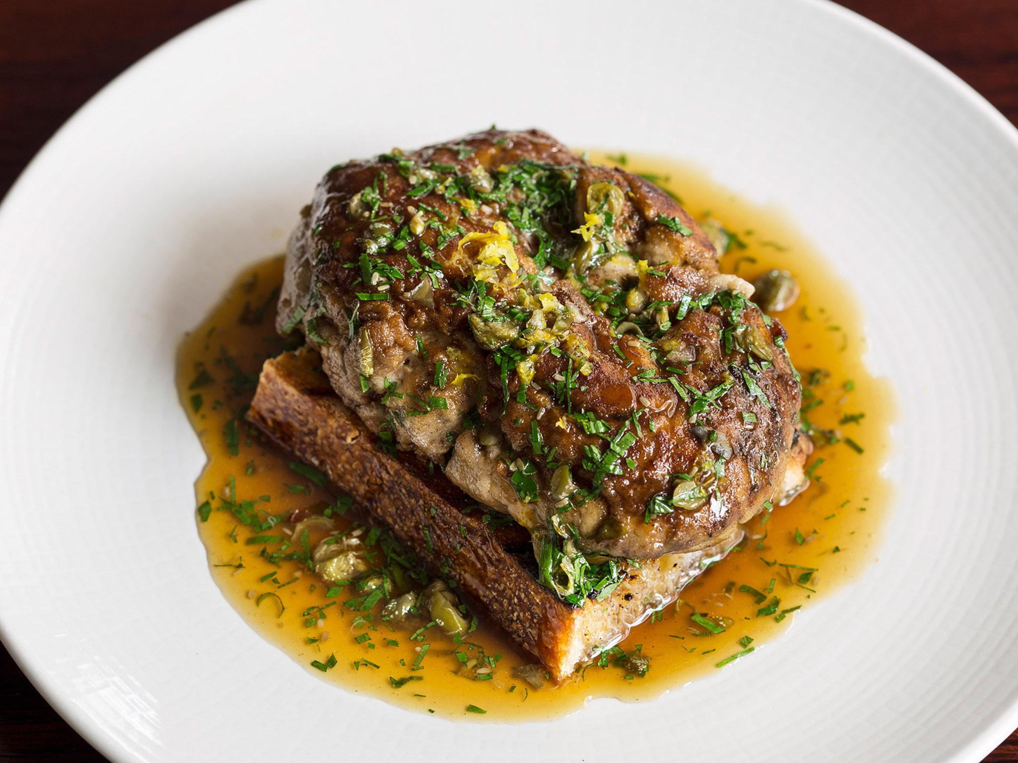 The brains were presented on a square of toast and drizzled with a capery meunière sauce