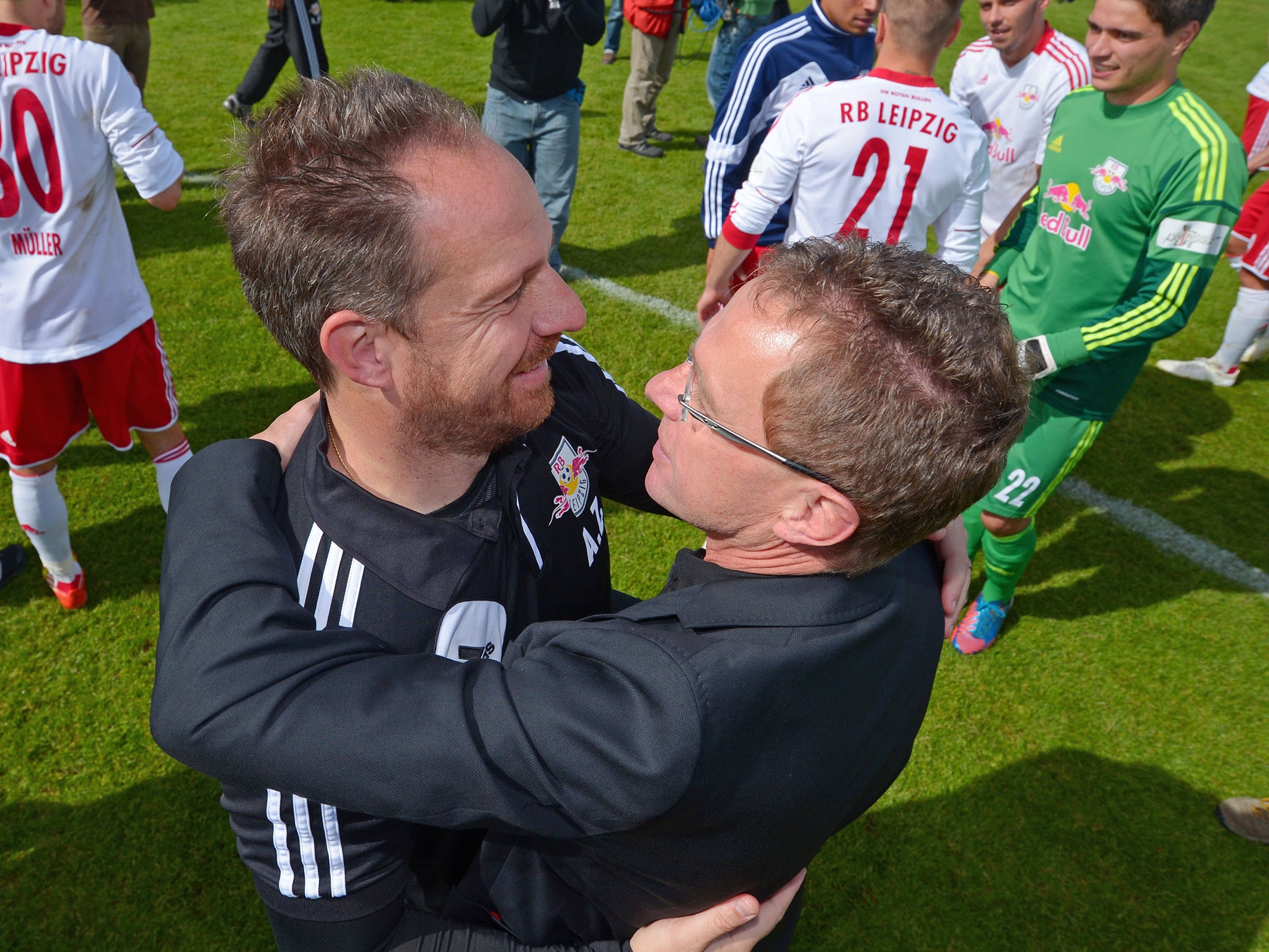 Rangnick, right, celebrates promotion from 2. Bundesliga with Leipzig