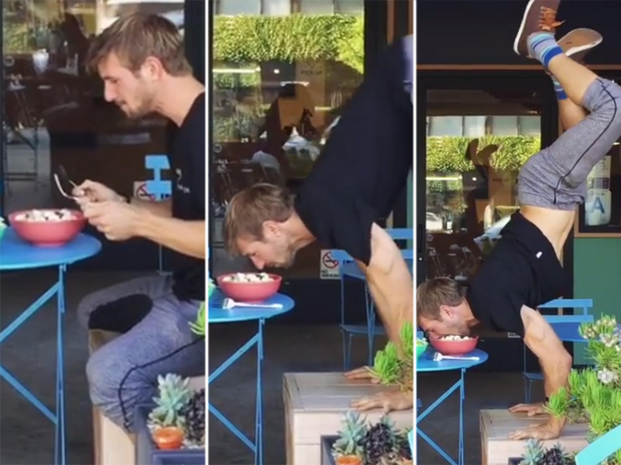 Nicholas Coolridge tucks into his food upside down