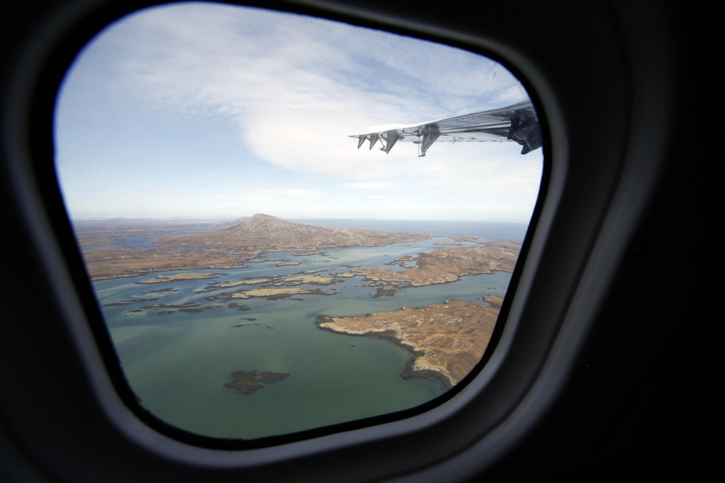 A view over mountainous North Uist, neighbouring Barra and linked to South Uist by a causeway