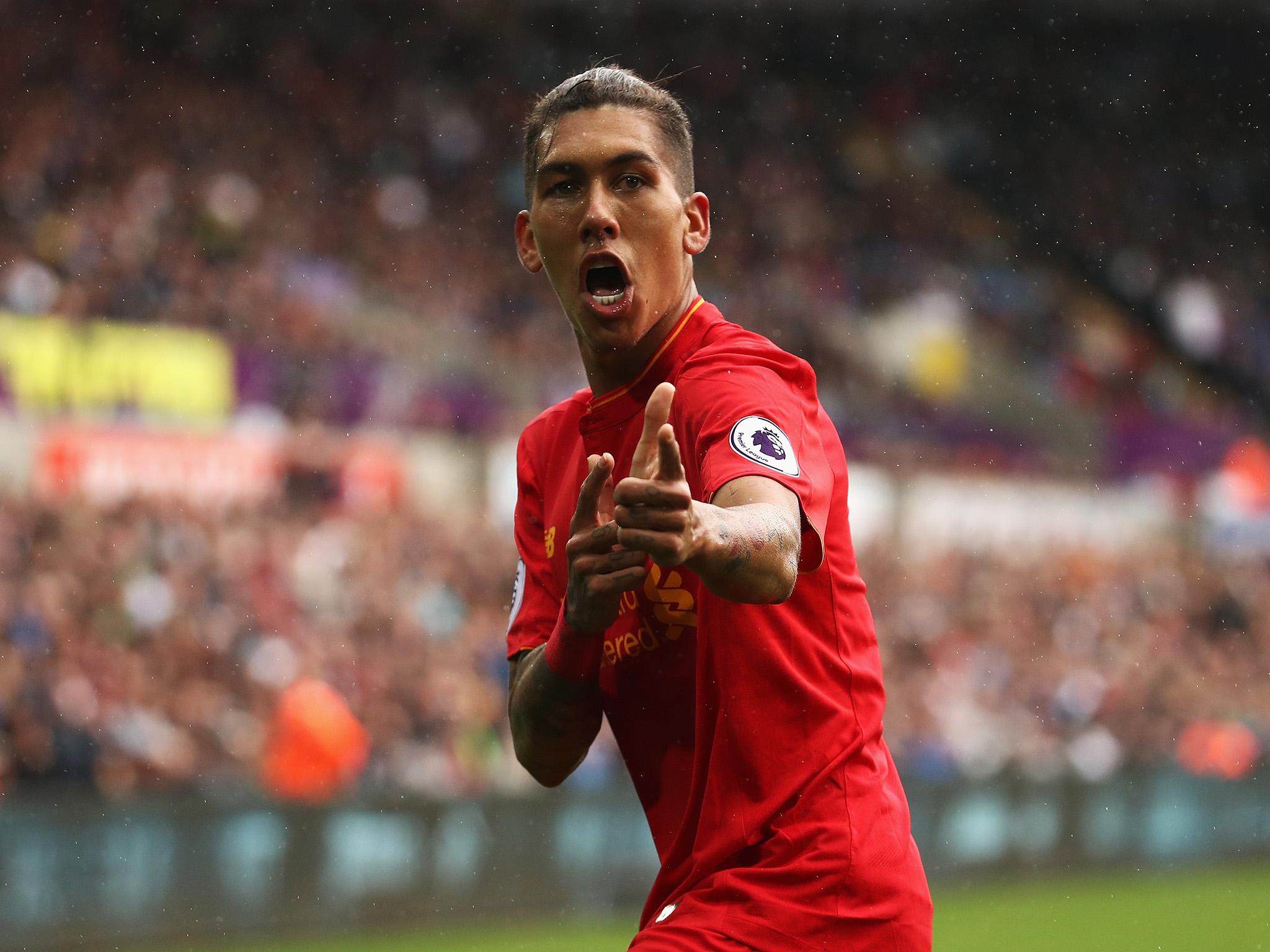 Firmino celebrates his strike at Swansea