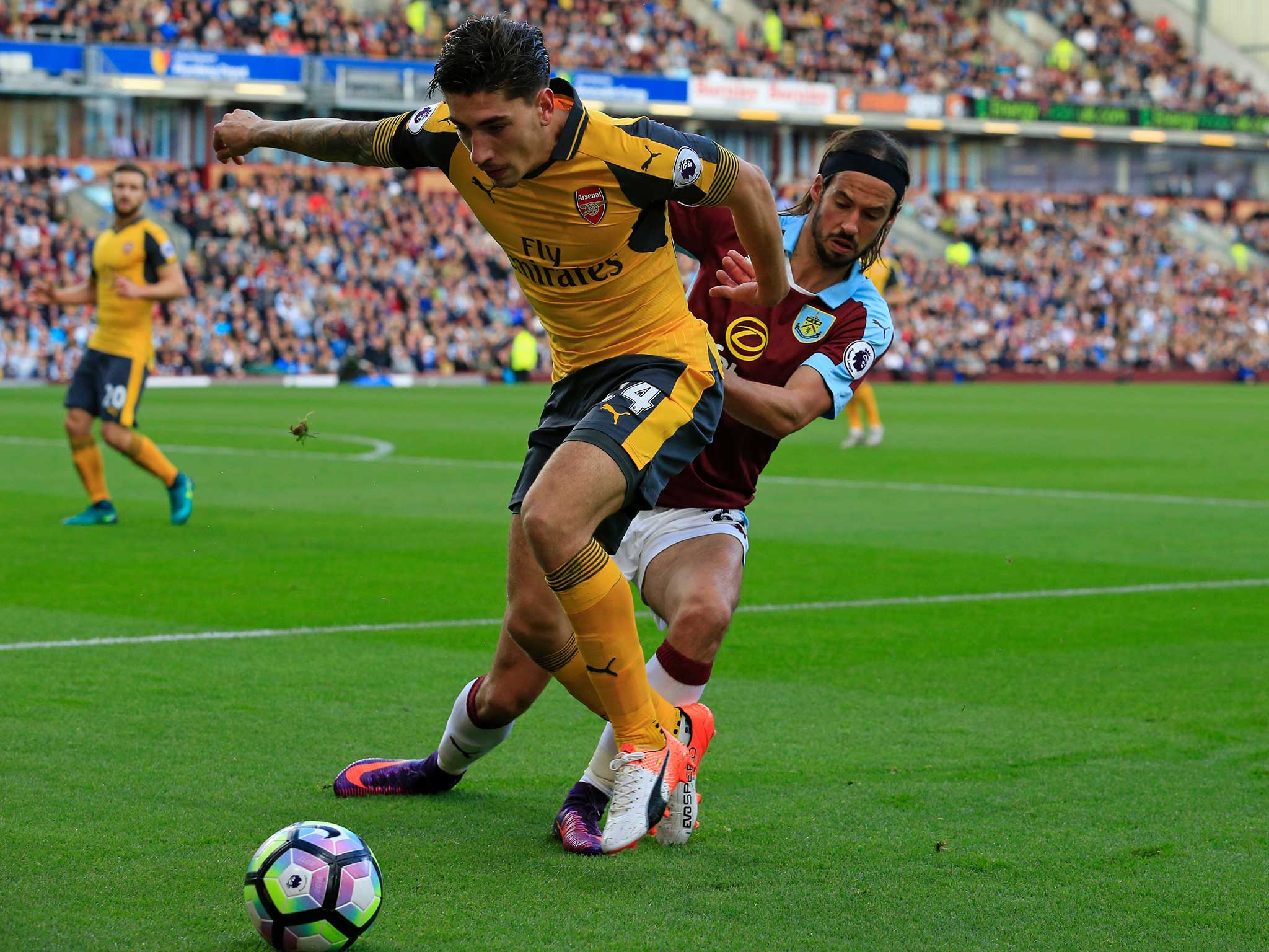 Hector Bellerin jostles for possession against Burnley