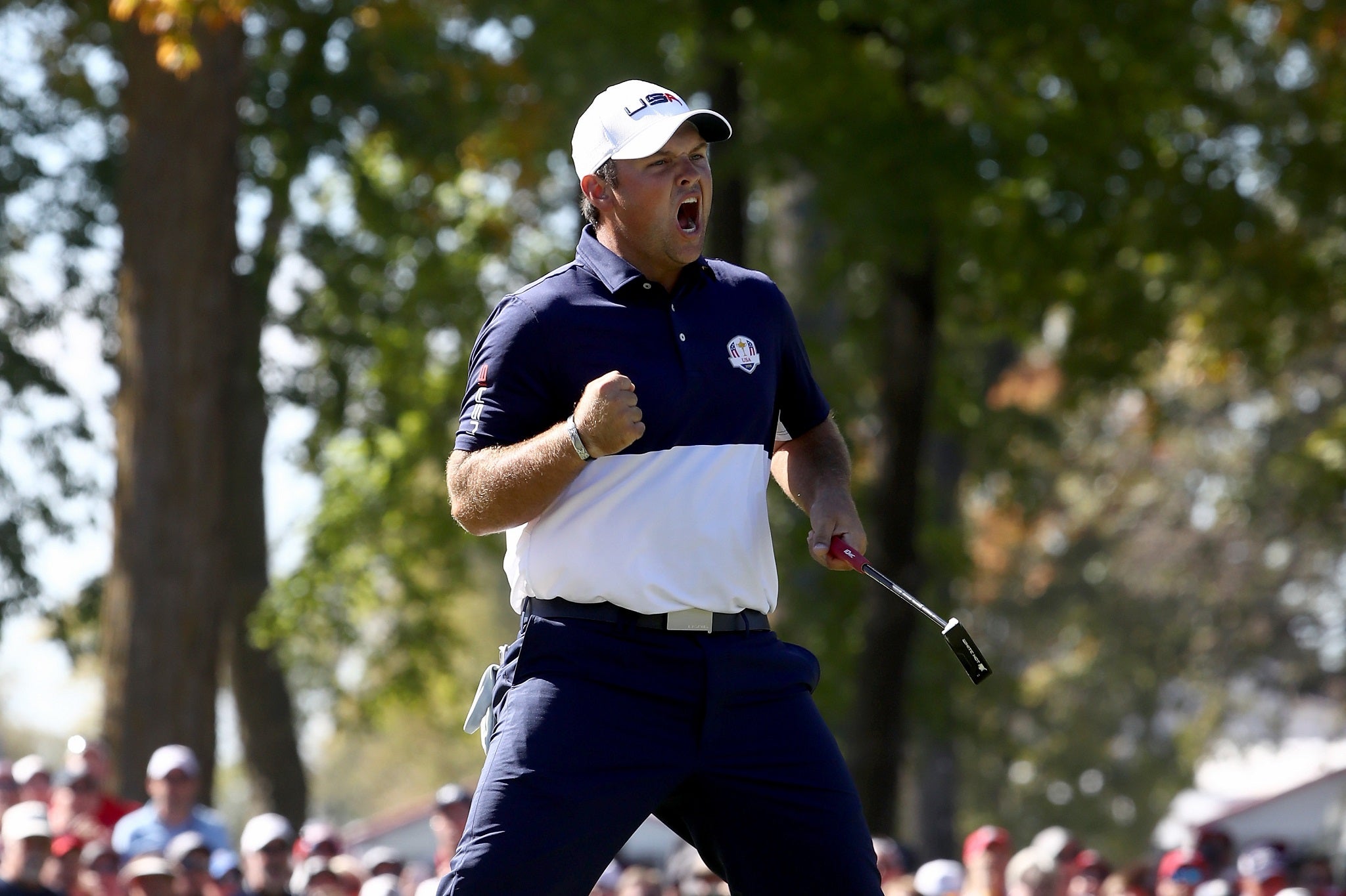 Patrick Reed celebrates his victory over Rory McIlroy