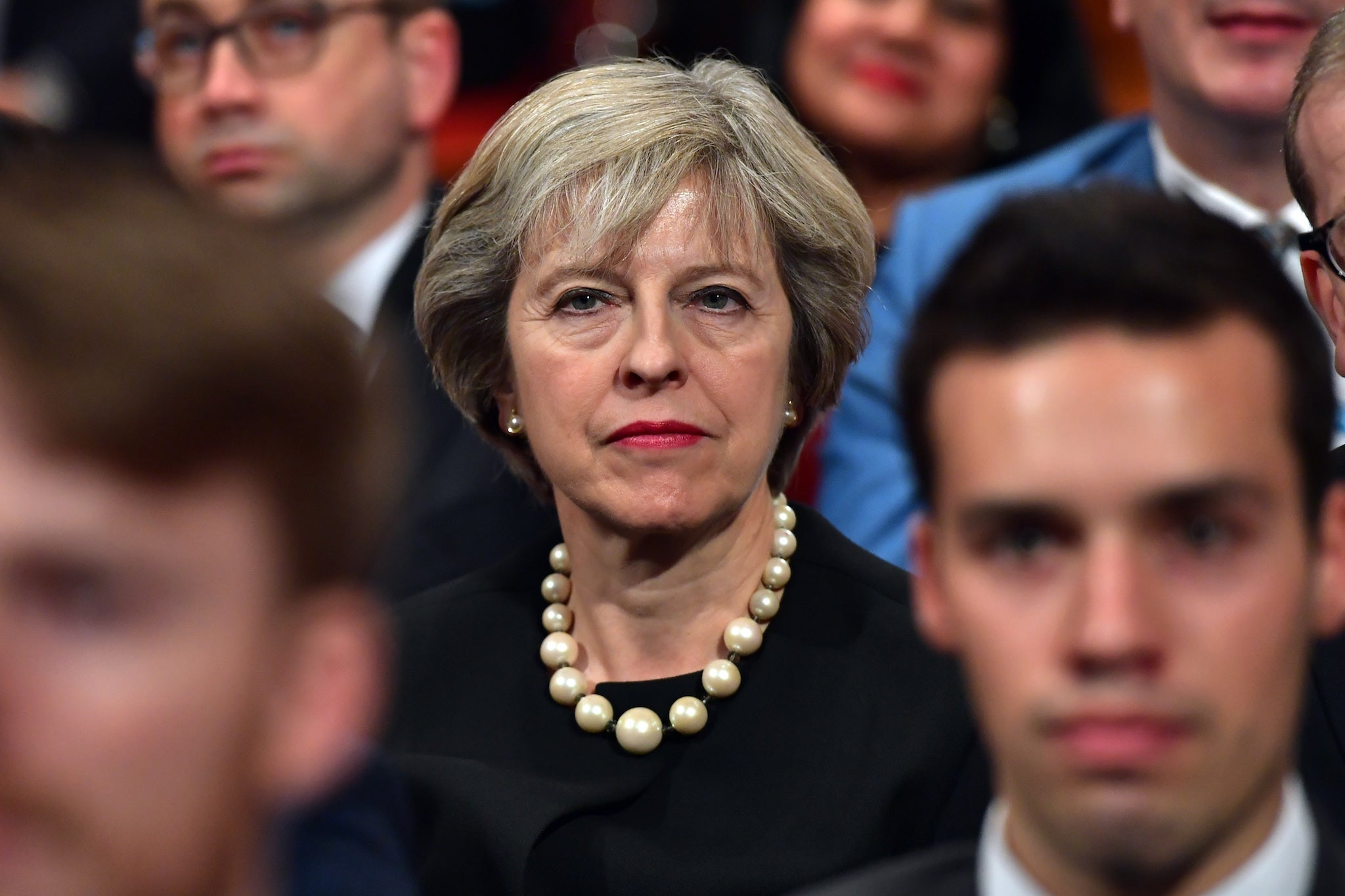 Theresa May sits in the audience before delivering a speech about Brexit on the first day of the Conservative Party Conference 2016 at the ICC Birmingham on October 2, 2016