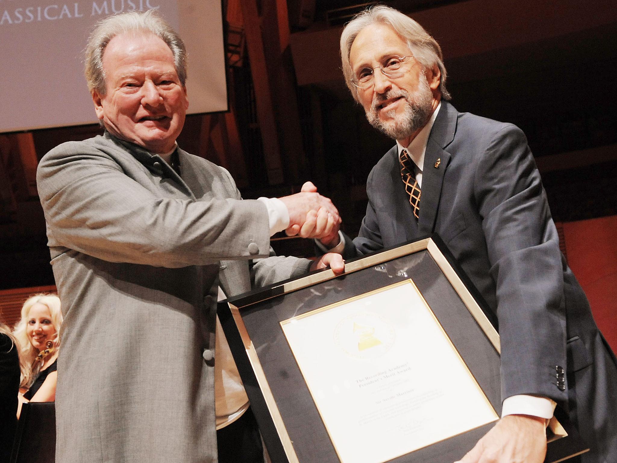 Honoree Sir Neville Marriner is given The President's Merit Award from President/CEO Neil Portnow at The Recording Academy tribute to Sir Neville Marriner and The Los Angeles Chamber Orchestra at The 2009 Grammy Salute to Classical Music held at The Disney Concert Hall on February 2nd in 2009 in Los Angeles California.