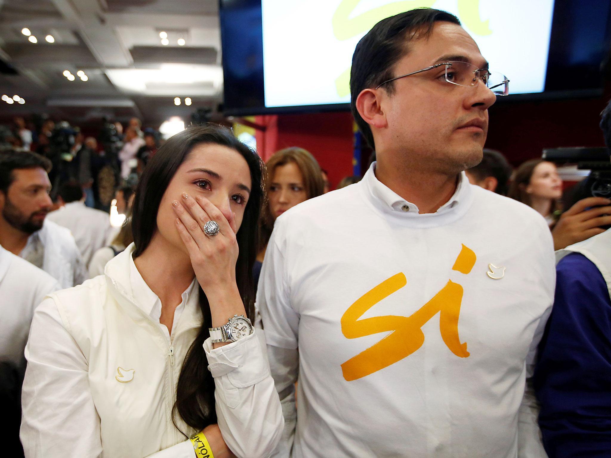 A supporter of "Si" vote cries after the nation voted "No" in a referendum on a peace deal between the government and the FARC