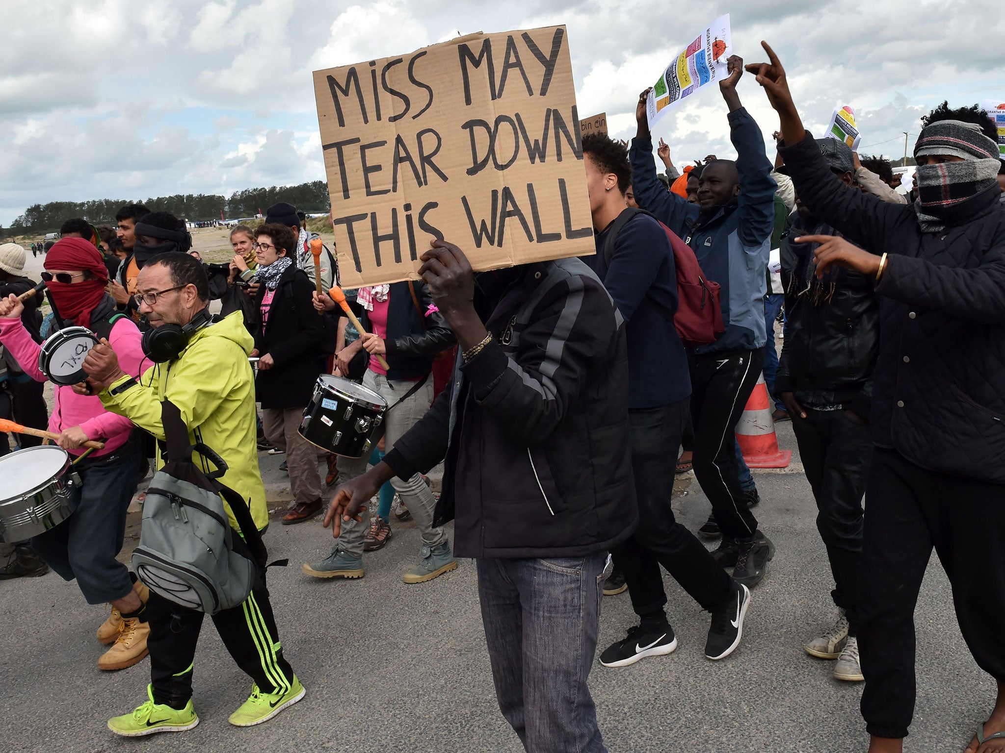 Residents of the Calais Jungle camp have been protesting about its scheduled demolition and plans to build a wall