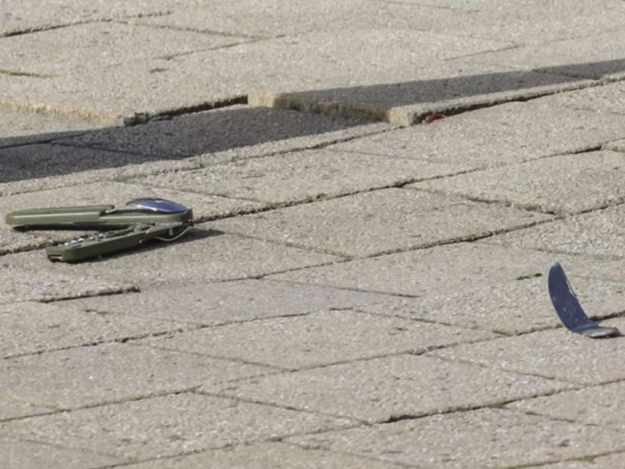 A knife lies on the ground at the scene of the attack