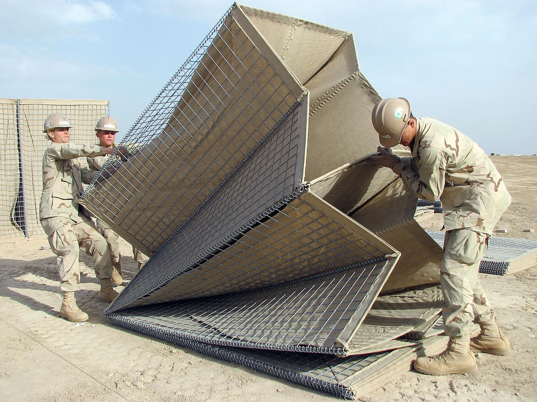 United States Navy sailors assembling HESCO bastions