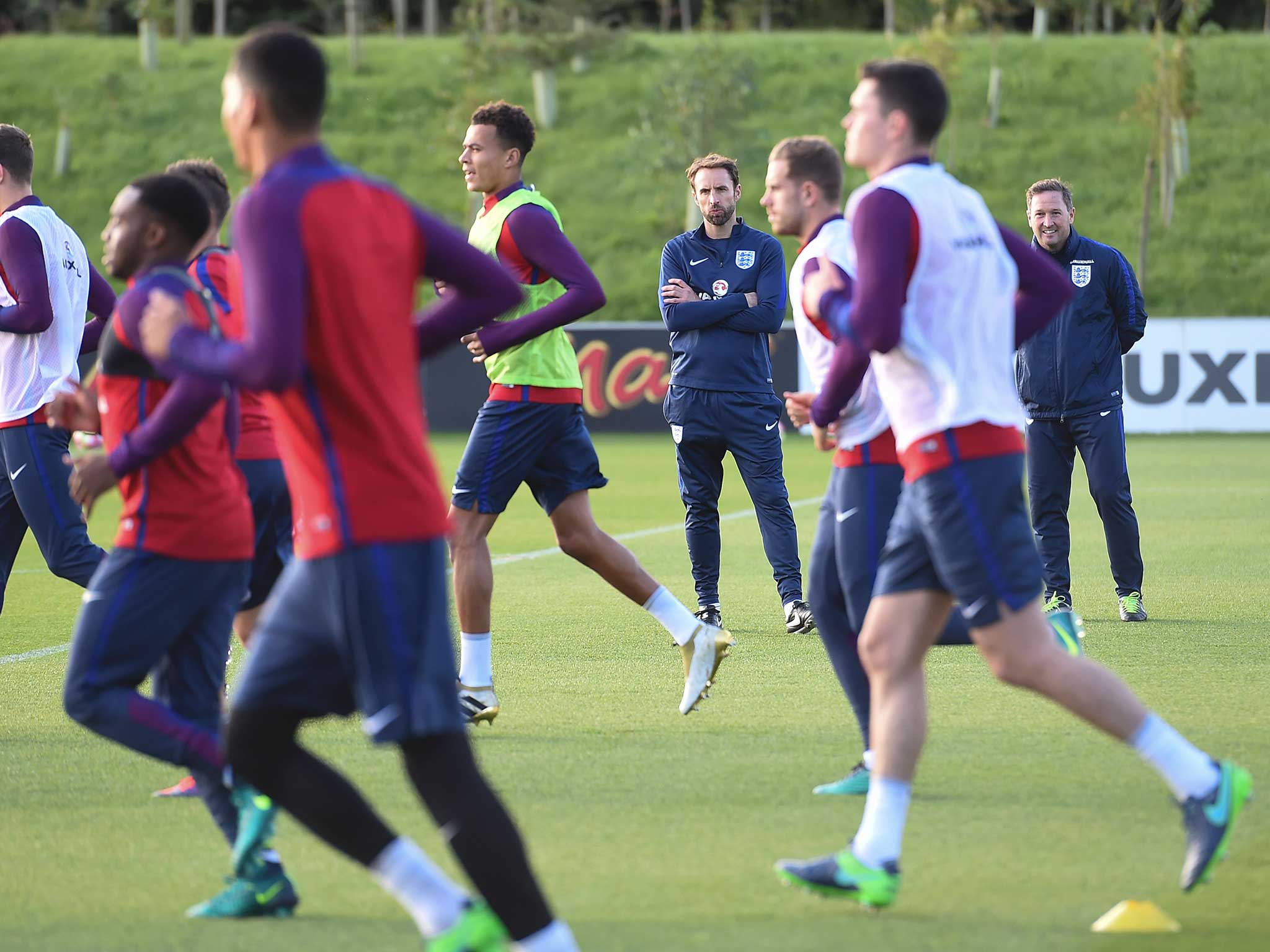 Gareth Southgate watches over the England squad during training